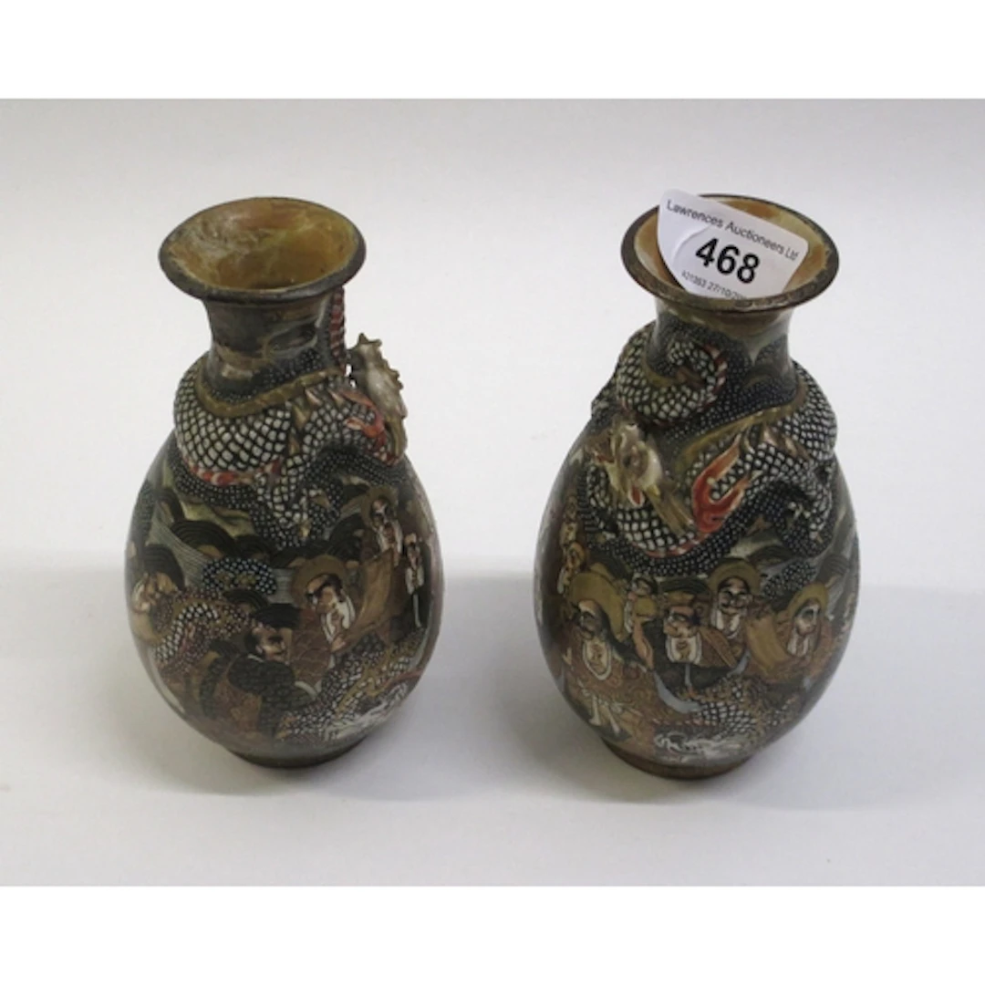 Pair of Japanese Satsuma pottery baluster form vases, relief...
