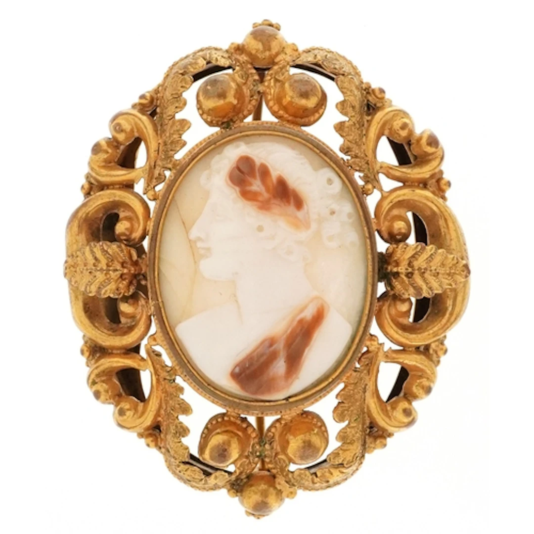 Antique yellow metal cameo shell brooch carved with a maiden...