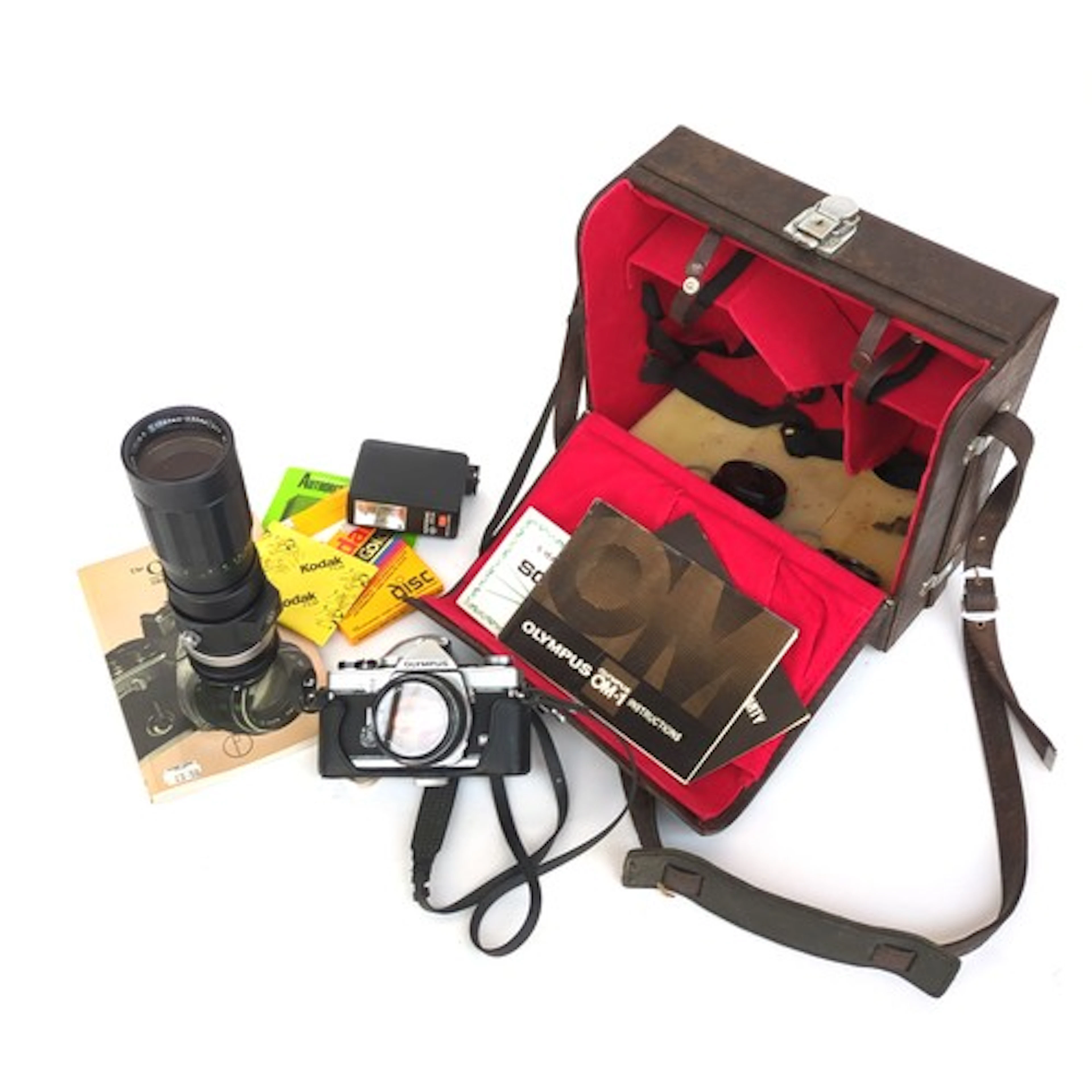 An Olympus OM-1 camera in case, together with a Soligor 90-2...