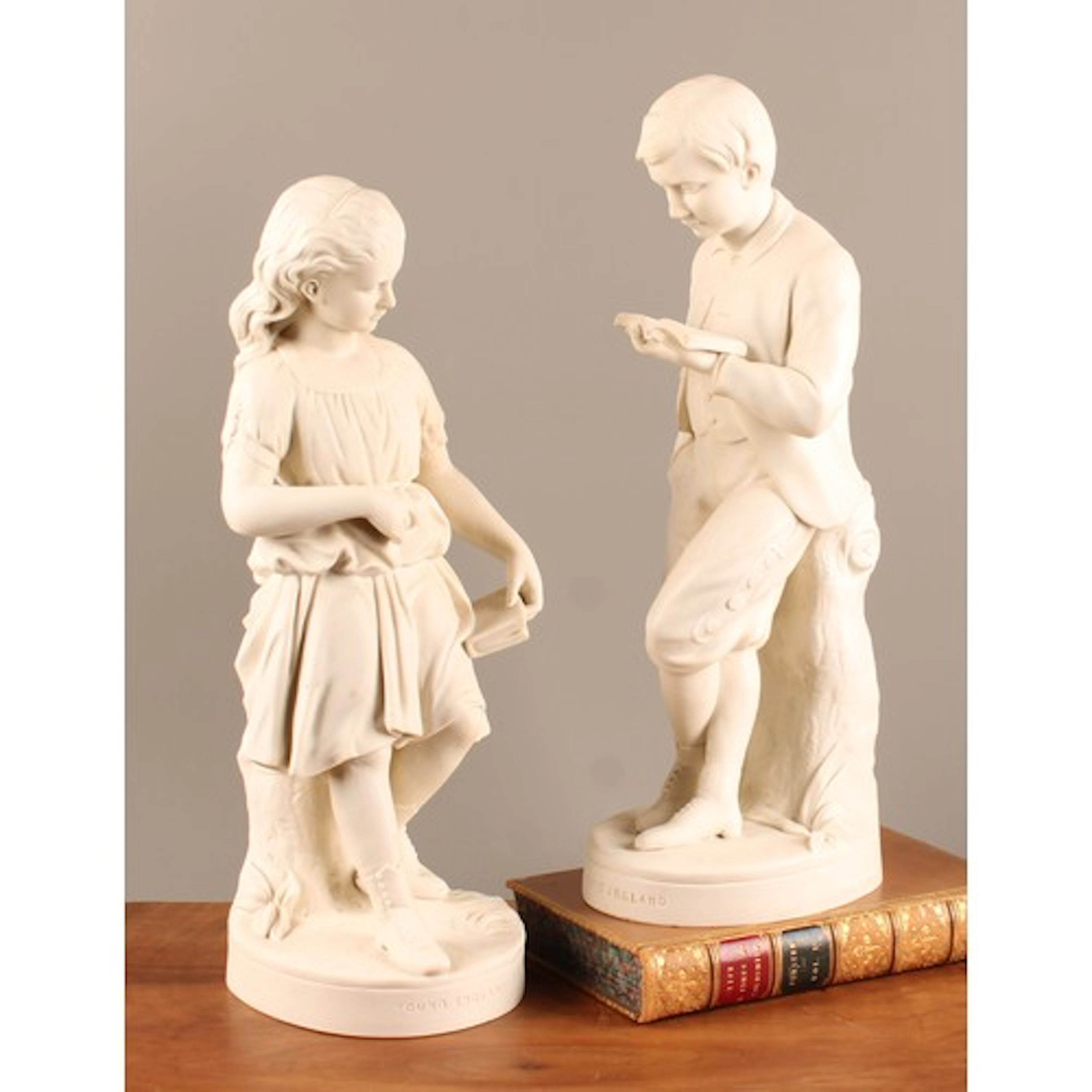 A pair of Copeland Parian ware figures, Young England and hi...