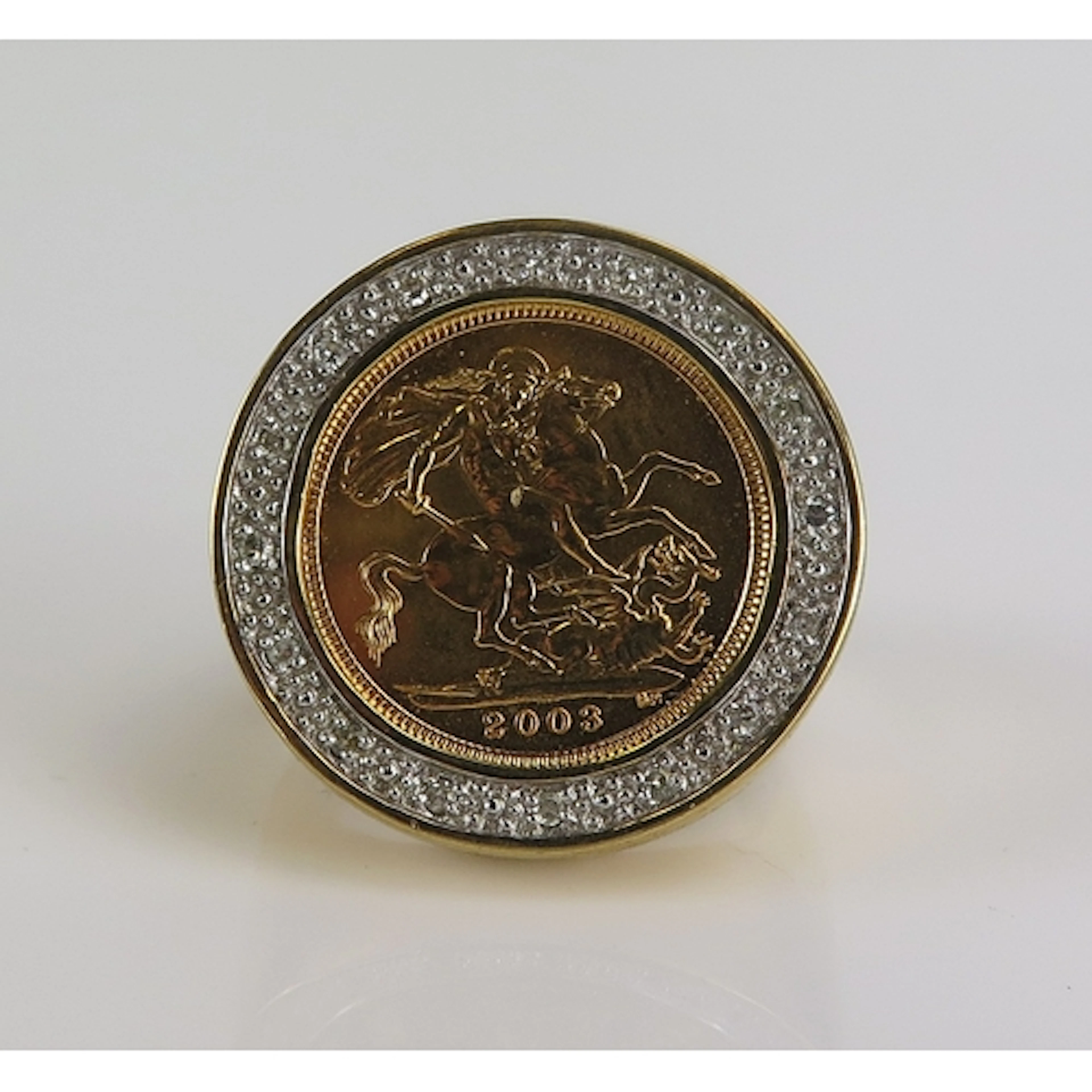 A Half Sovereign Ring with diamond surround in a 9ct yellow ...