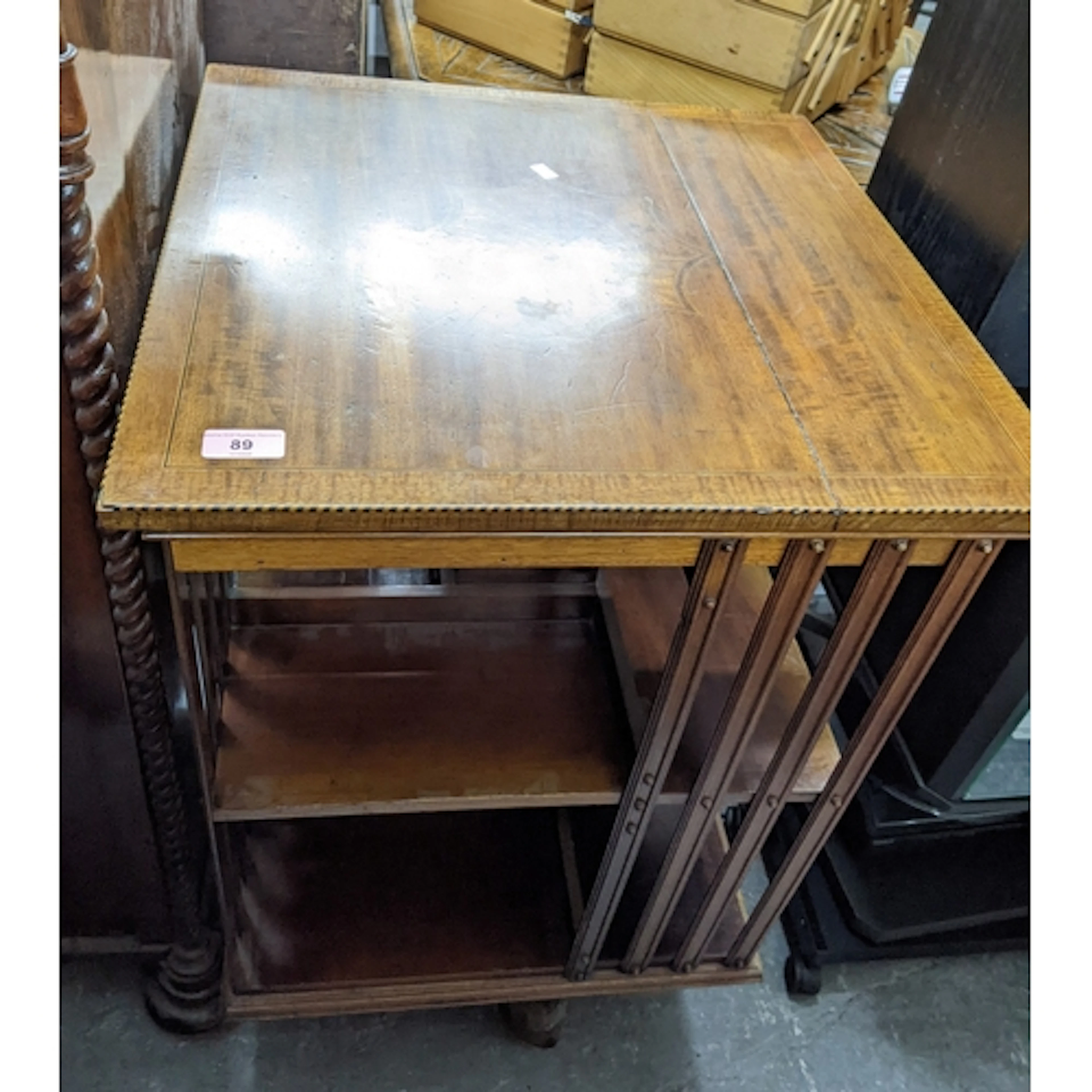 A late Victorian/Edwardian revolving bookstand, inlaid mahog...