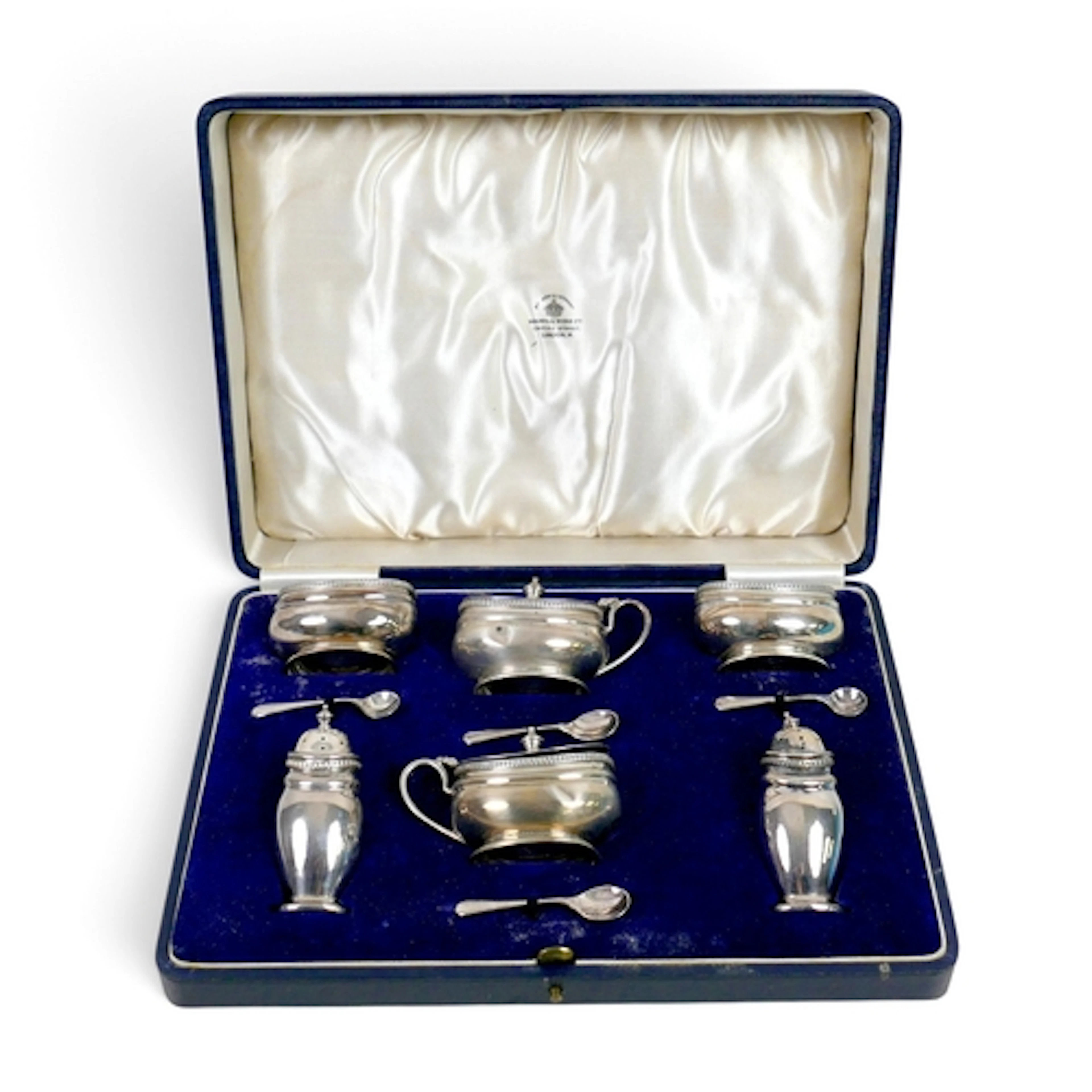 A GEORGE V SILVER SIX-PIECE CRUET SET. comprising two oval s...