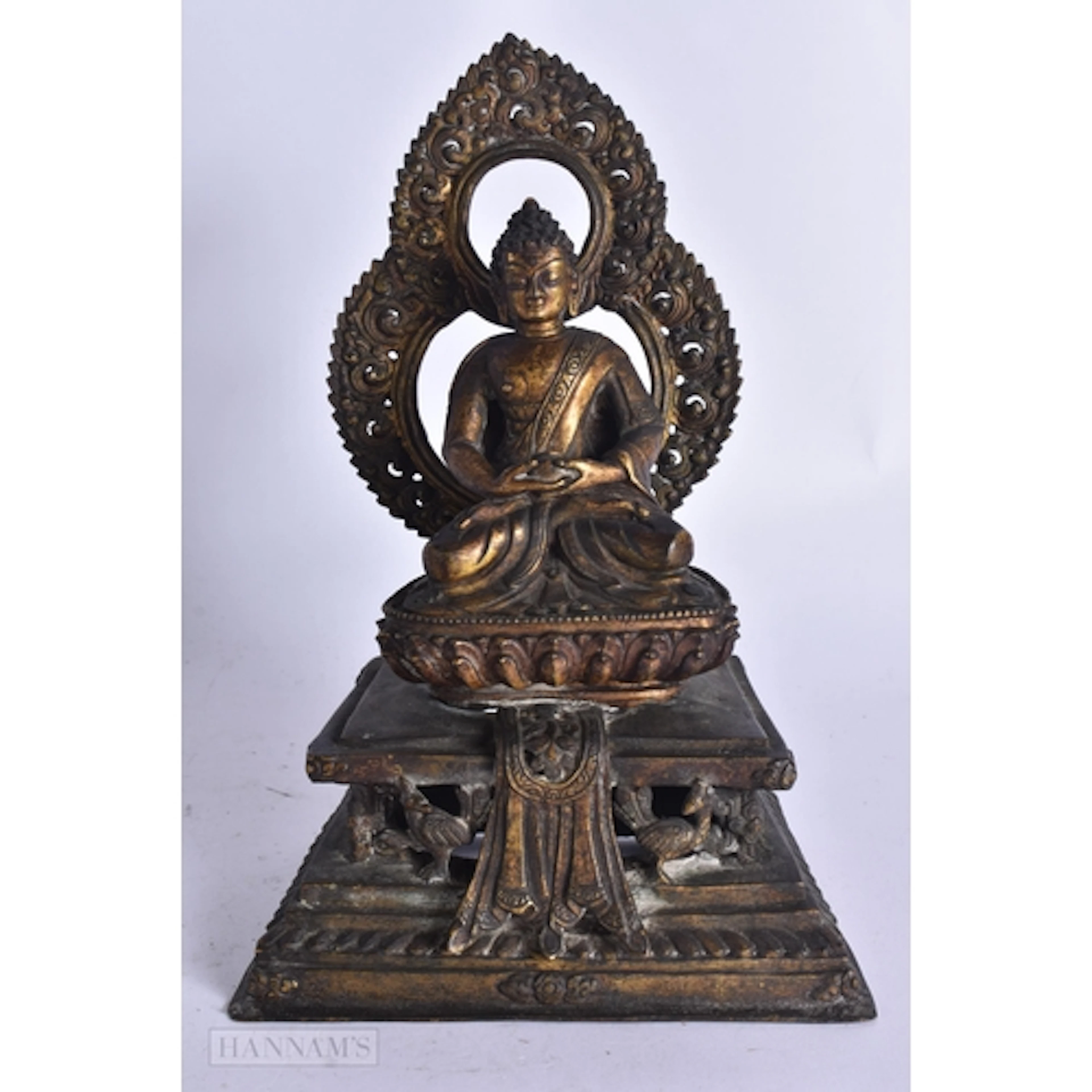 A CHINESE TIBETAN QING DYNASTY BRONZE BUDDHA modelled upon a...