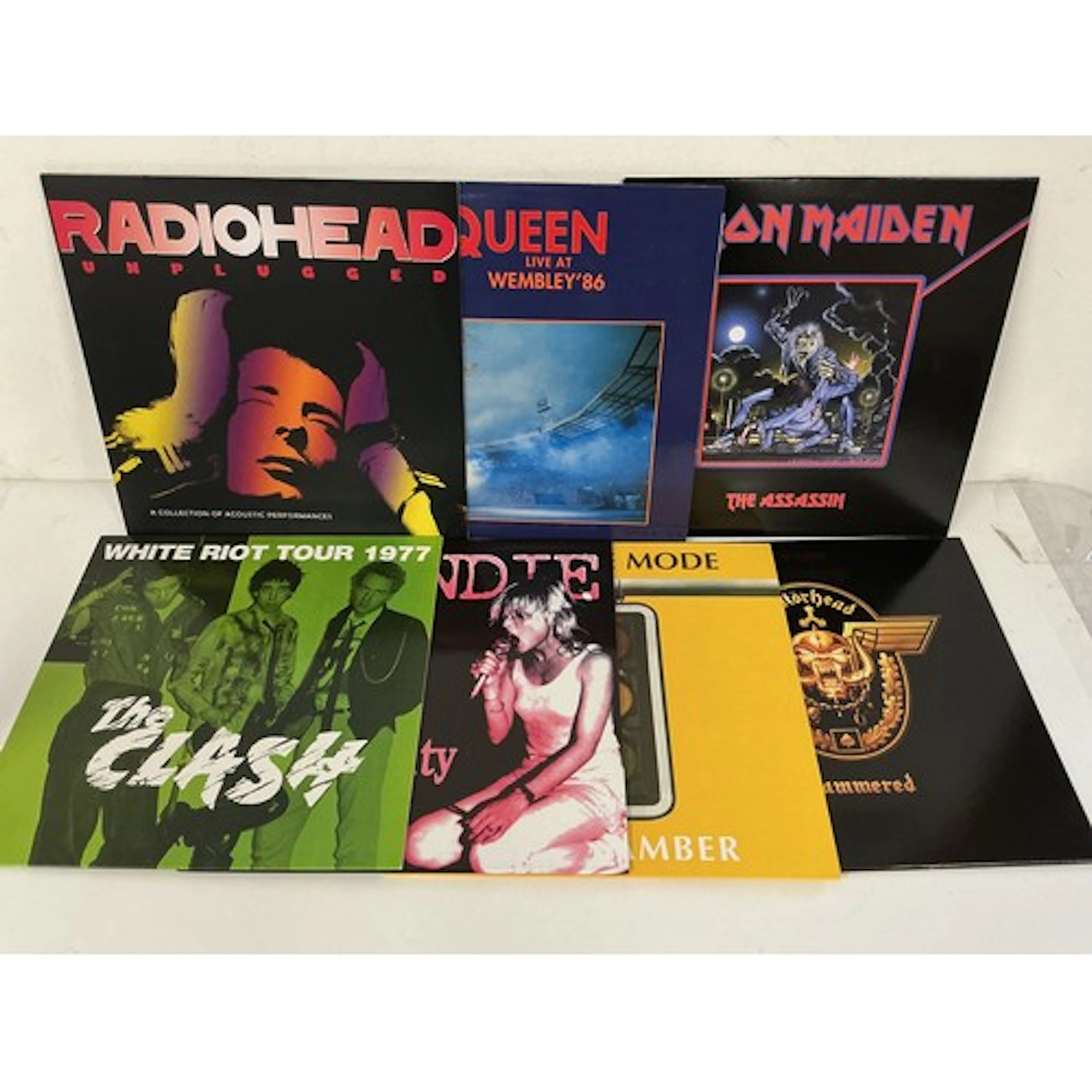 Seven rock LPs by various artists including Queen, The Clash...