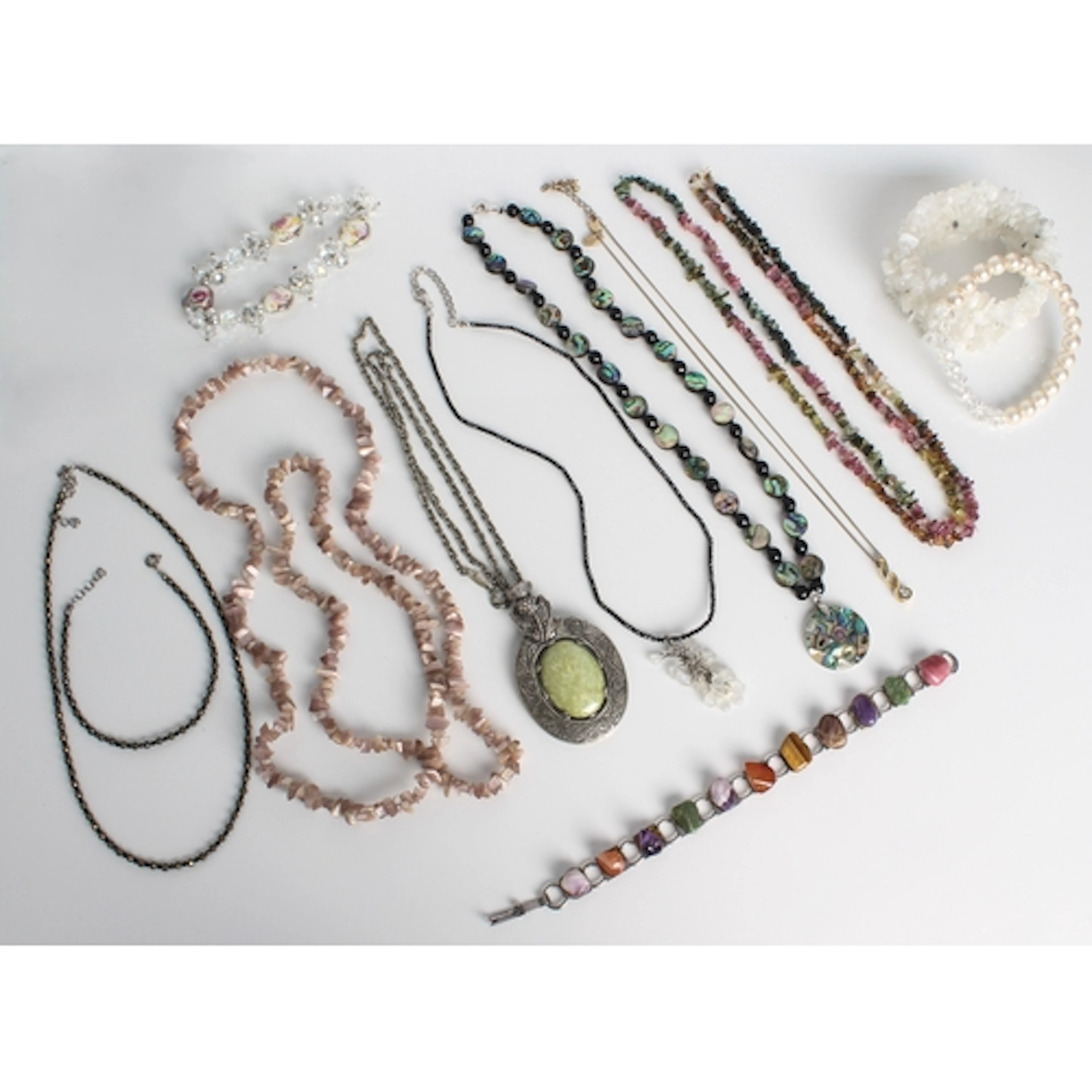 A collection of jewellery, comprising - a Scottish thistle p...