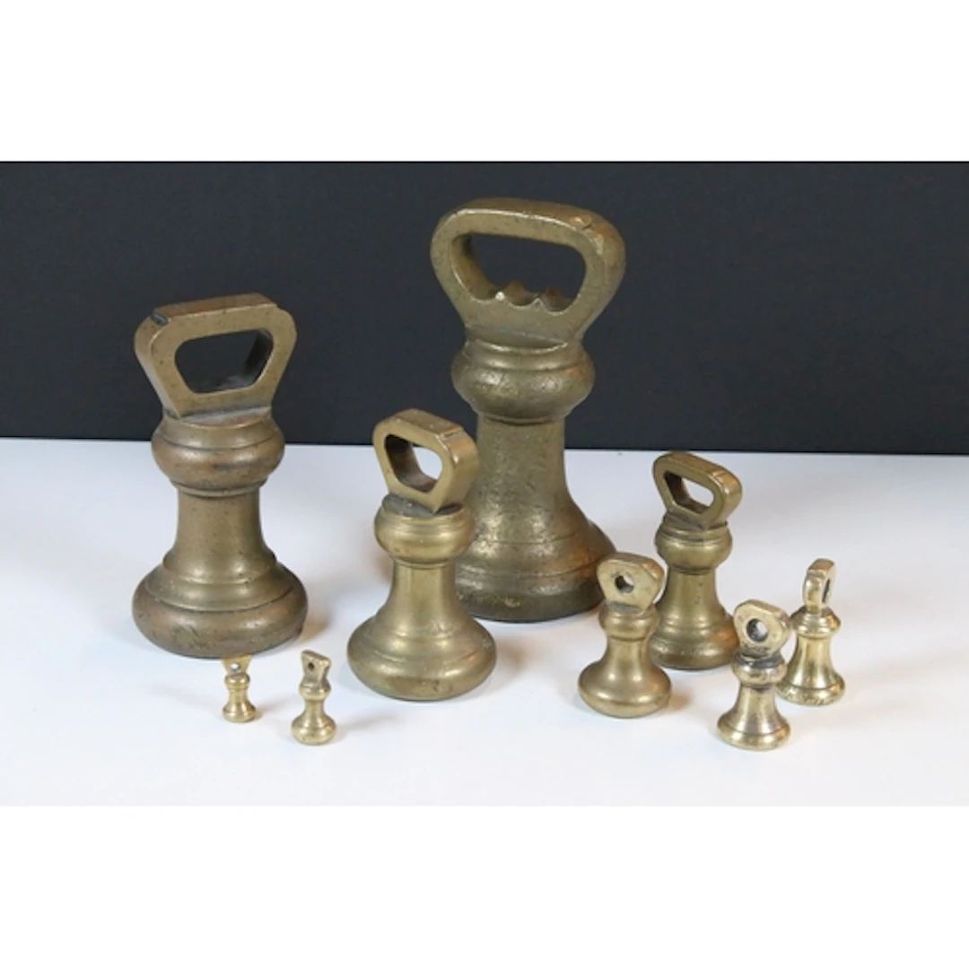 Set of late 19th/early 20th century graduated brass bell wei...