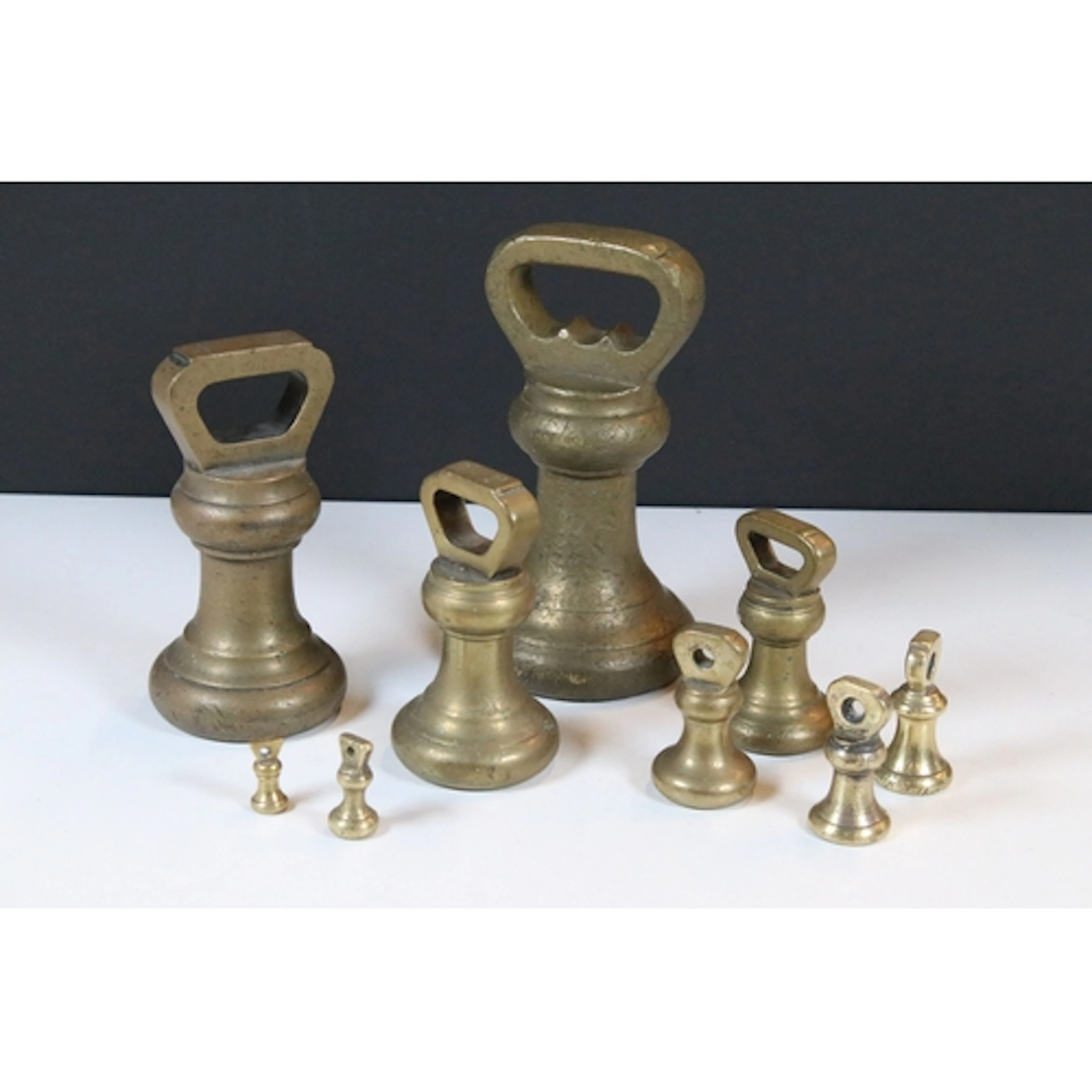 Set of late 19th/early 20th century graduated brass bell wei...