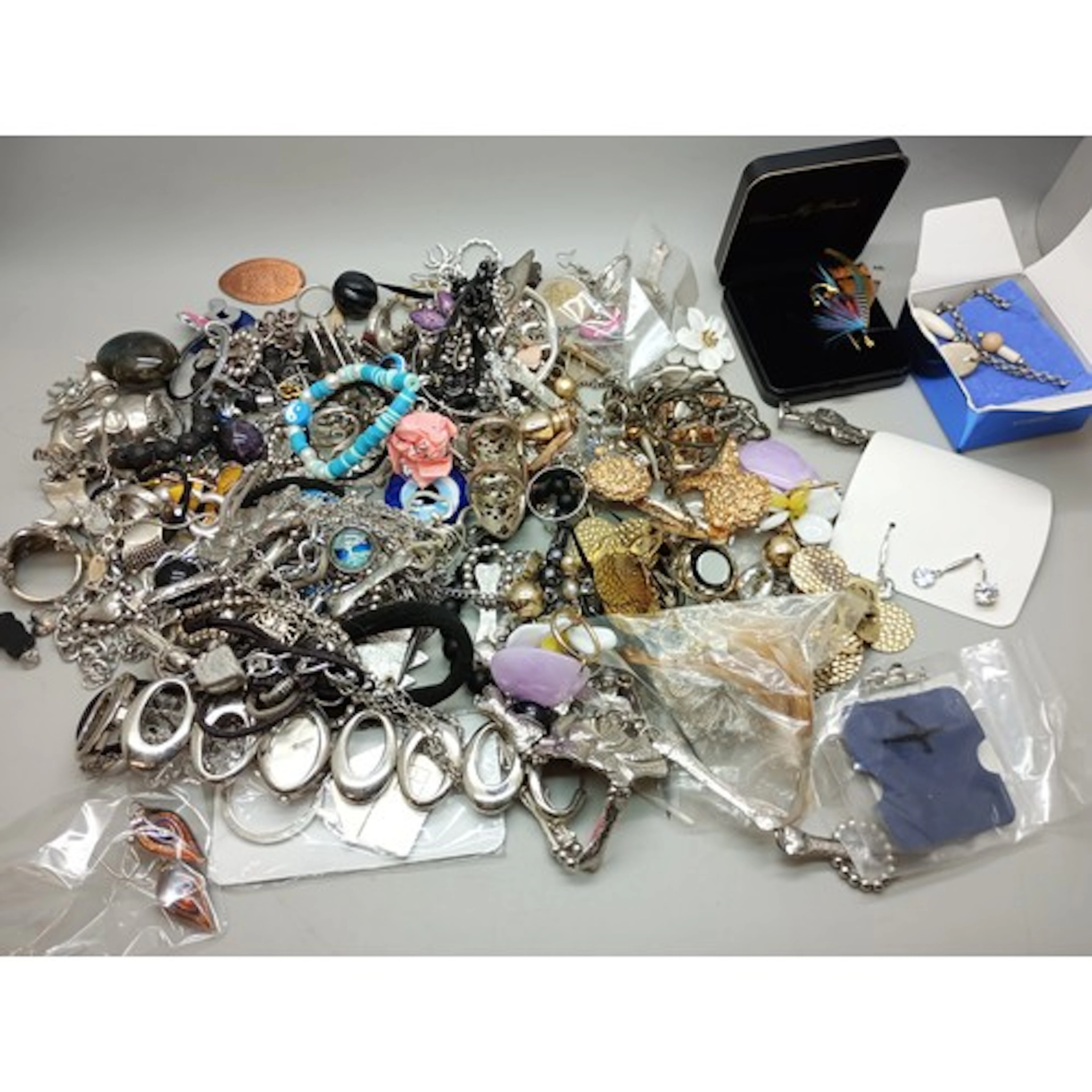 A collection of costume jewellery including earrings (some s...