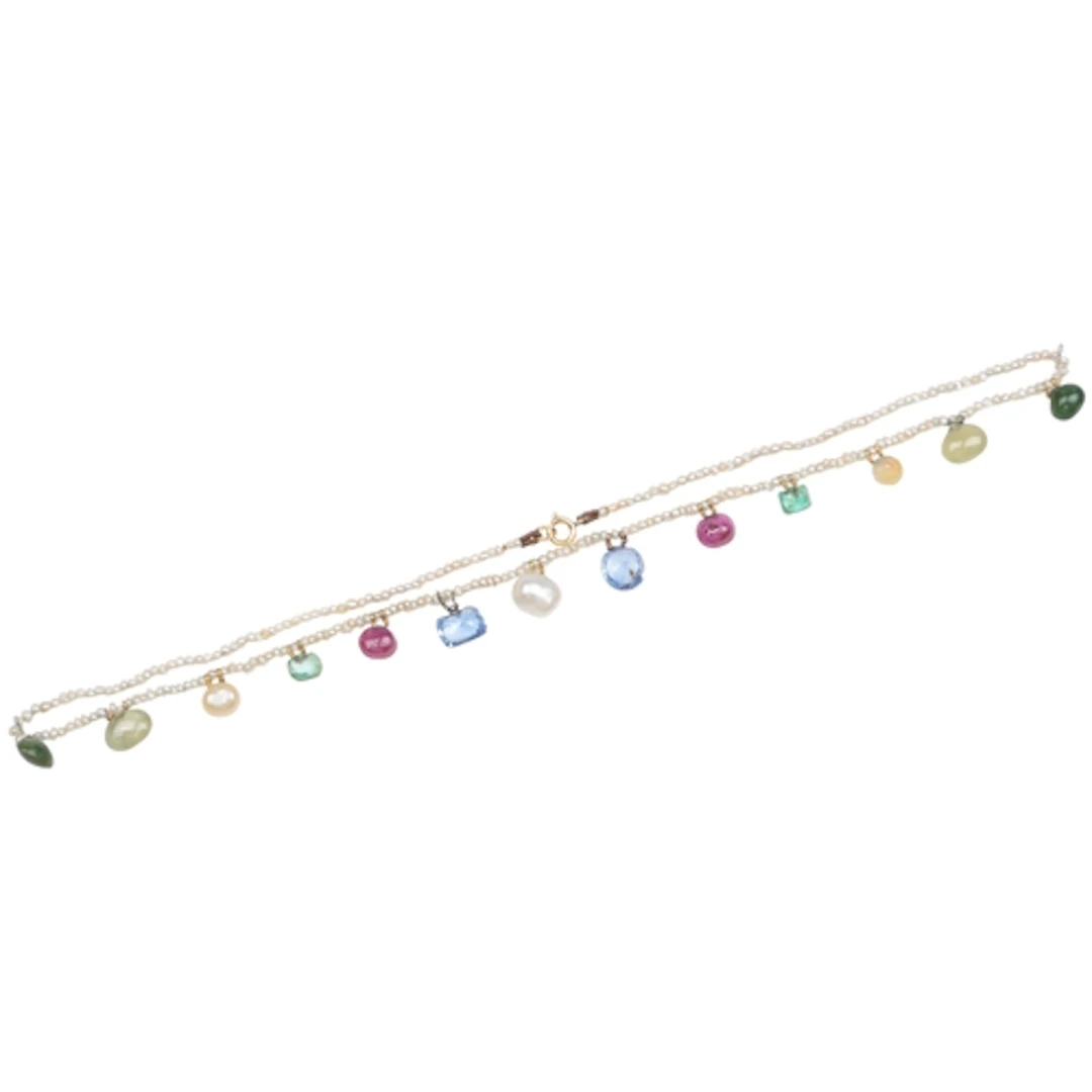 A seed pearl and gem-set fringe necklace, designed as a stra...