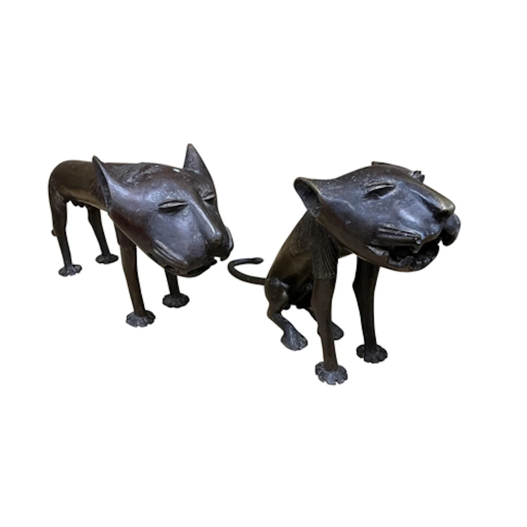 Two Benin style bronze lions, larger 20cm.