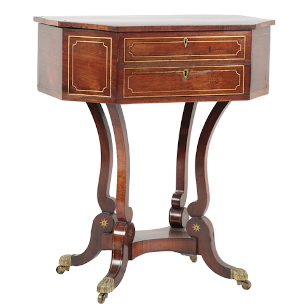 A late Regency rosewood and cut brass inlaid octagonal sewin...