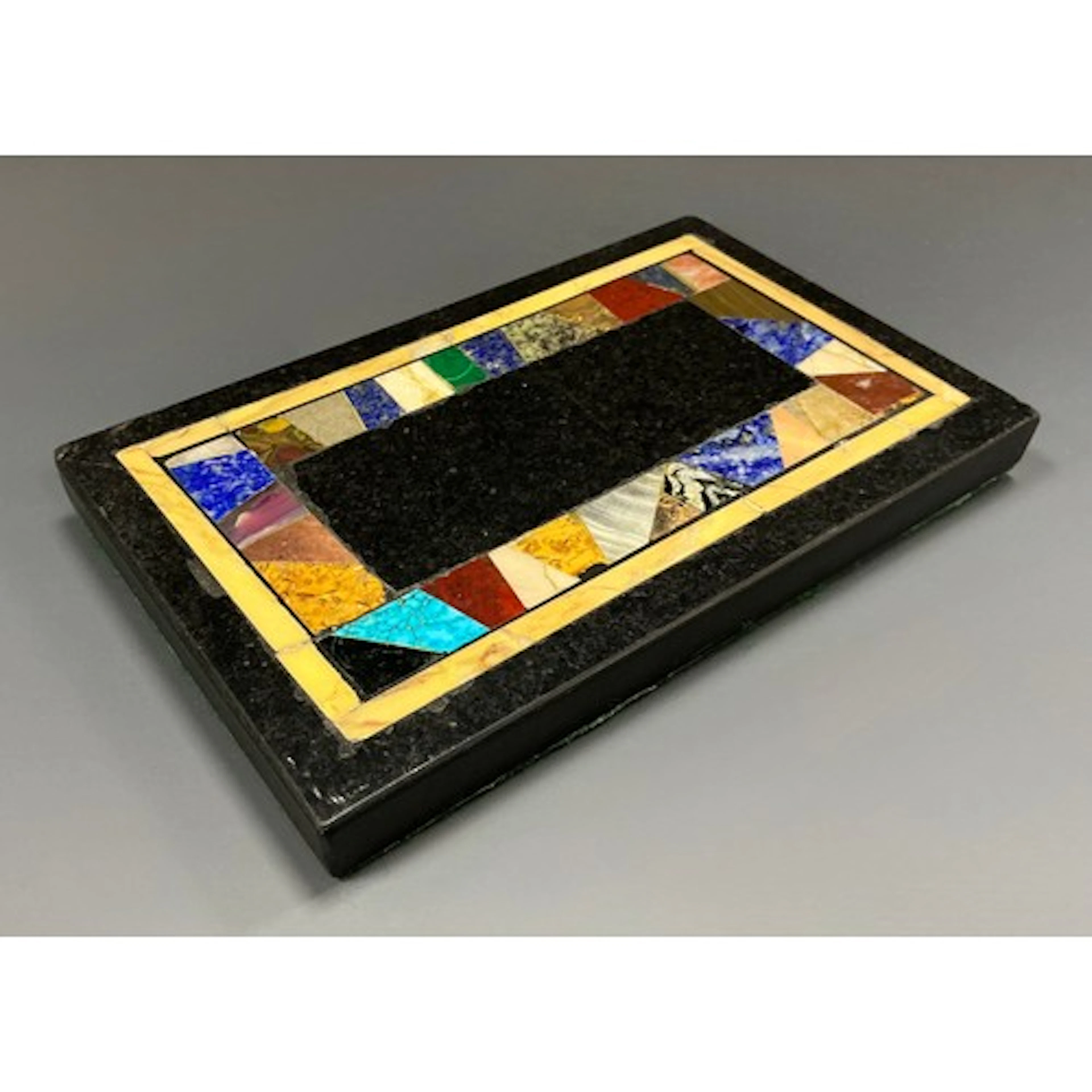 A marble rectangular desk weight, pietra dura inlaid with la...