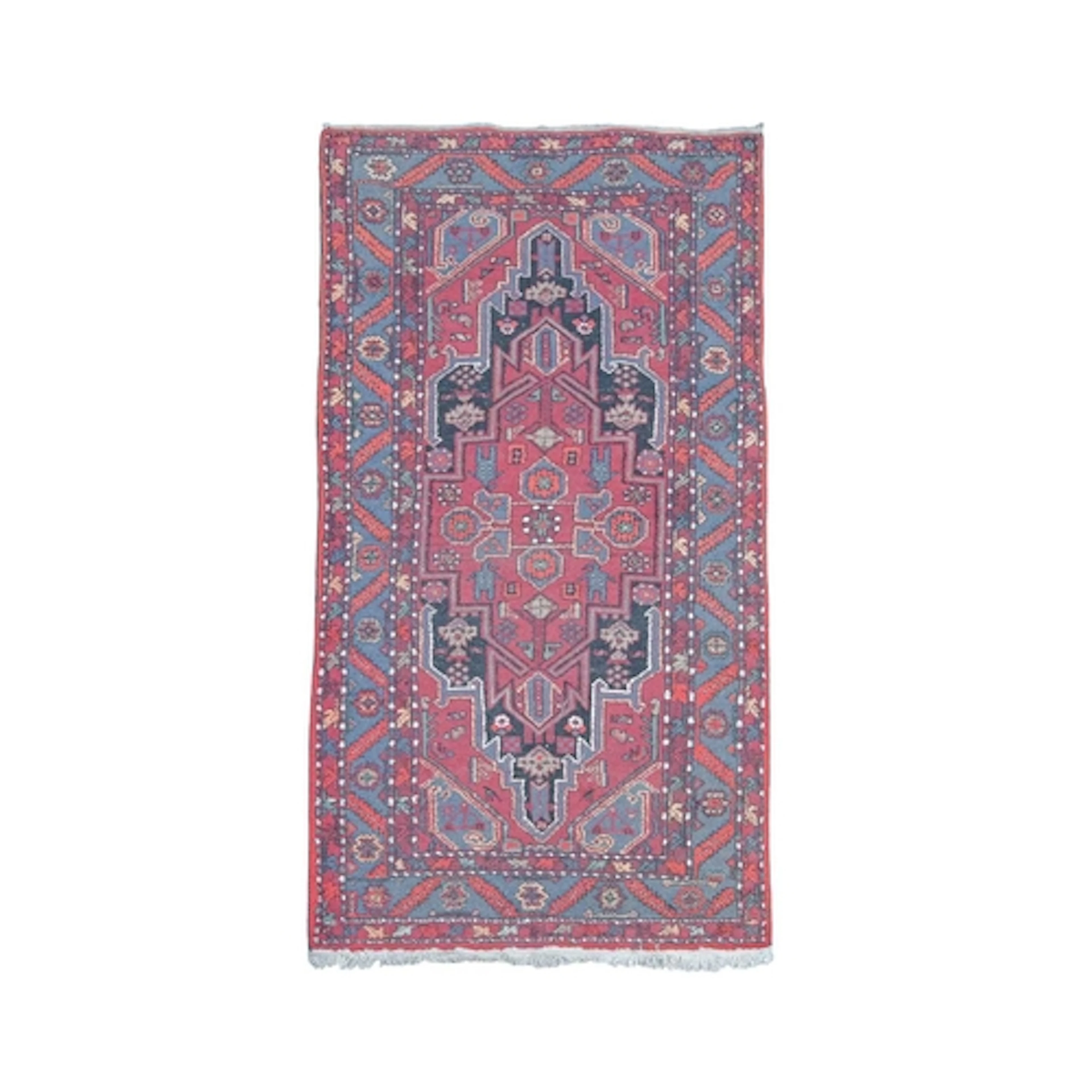 A Persian wool rug. The red ground decorated with tribal pat...