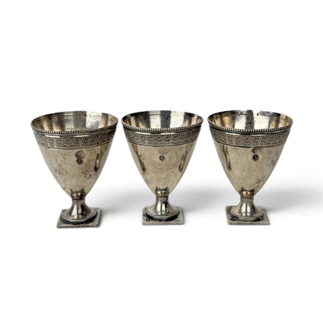 THREE PERSIAN SILVER SHOT CUPS 6cm H each. Total weight: 130...