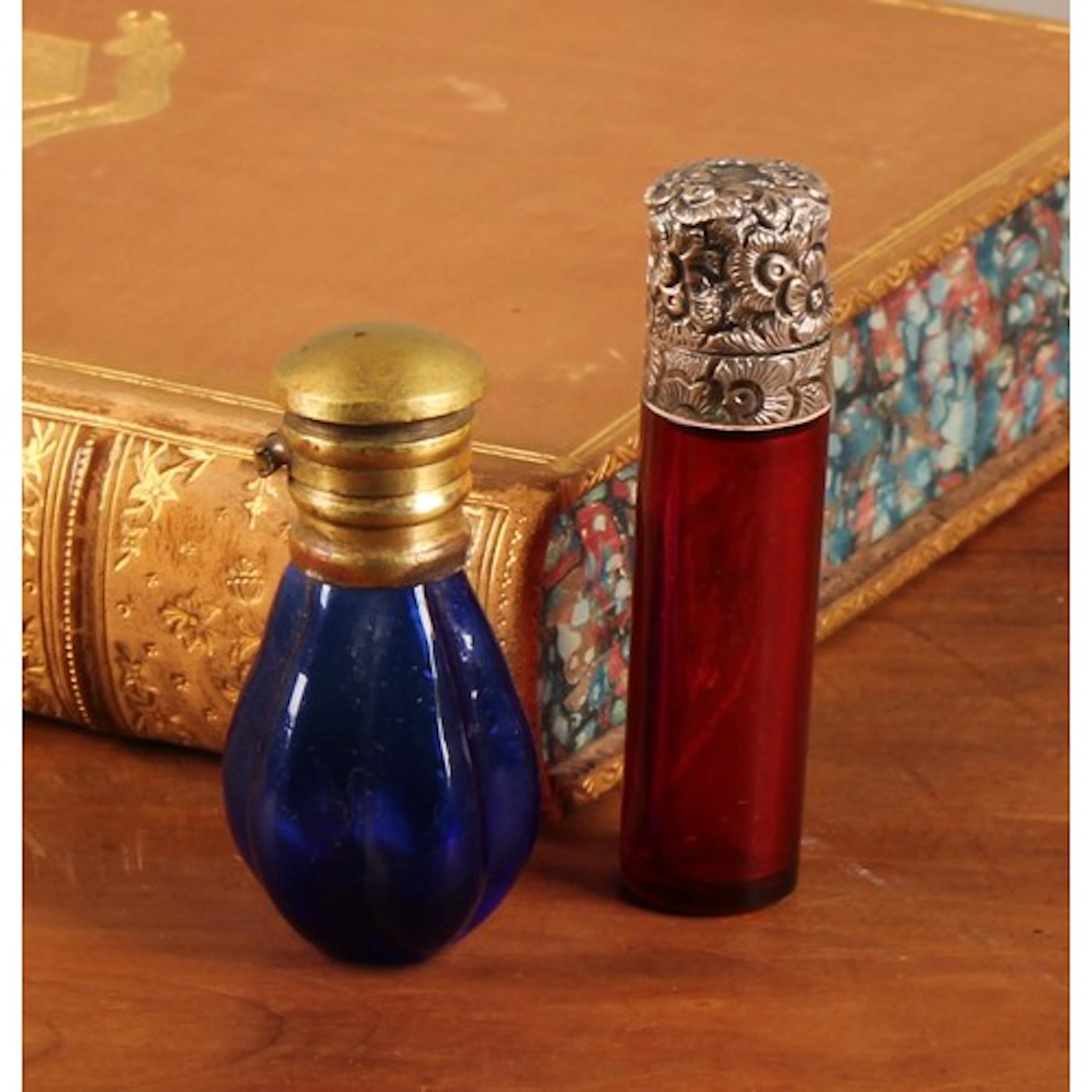 A 19th century silver mounted ruby glass cylindrical scent b...