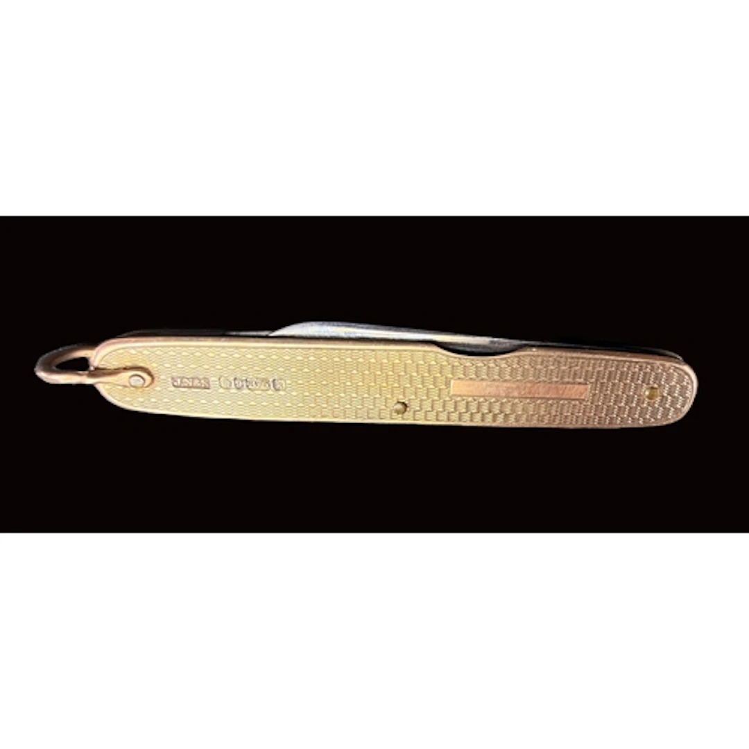 A 9ct gold cased pocket knife with engine turned pattern two...