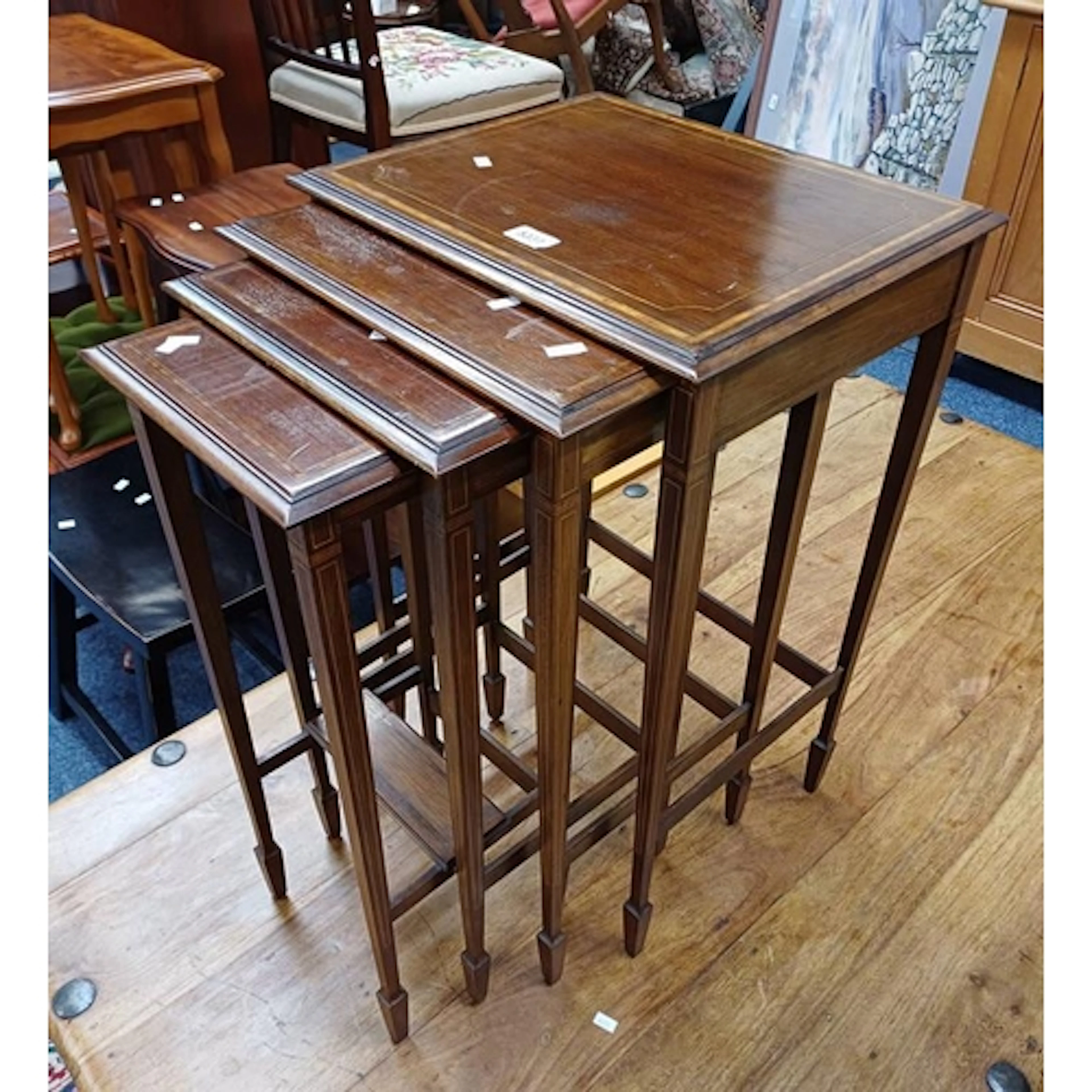 NEST OF 4 EARLY 20TH CENTURY INLAID MAHOGANY TABLES ON SQUAR...
