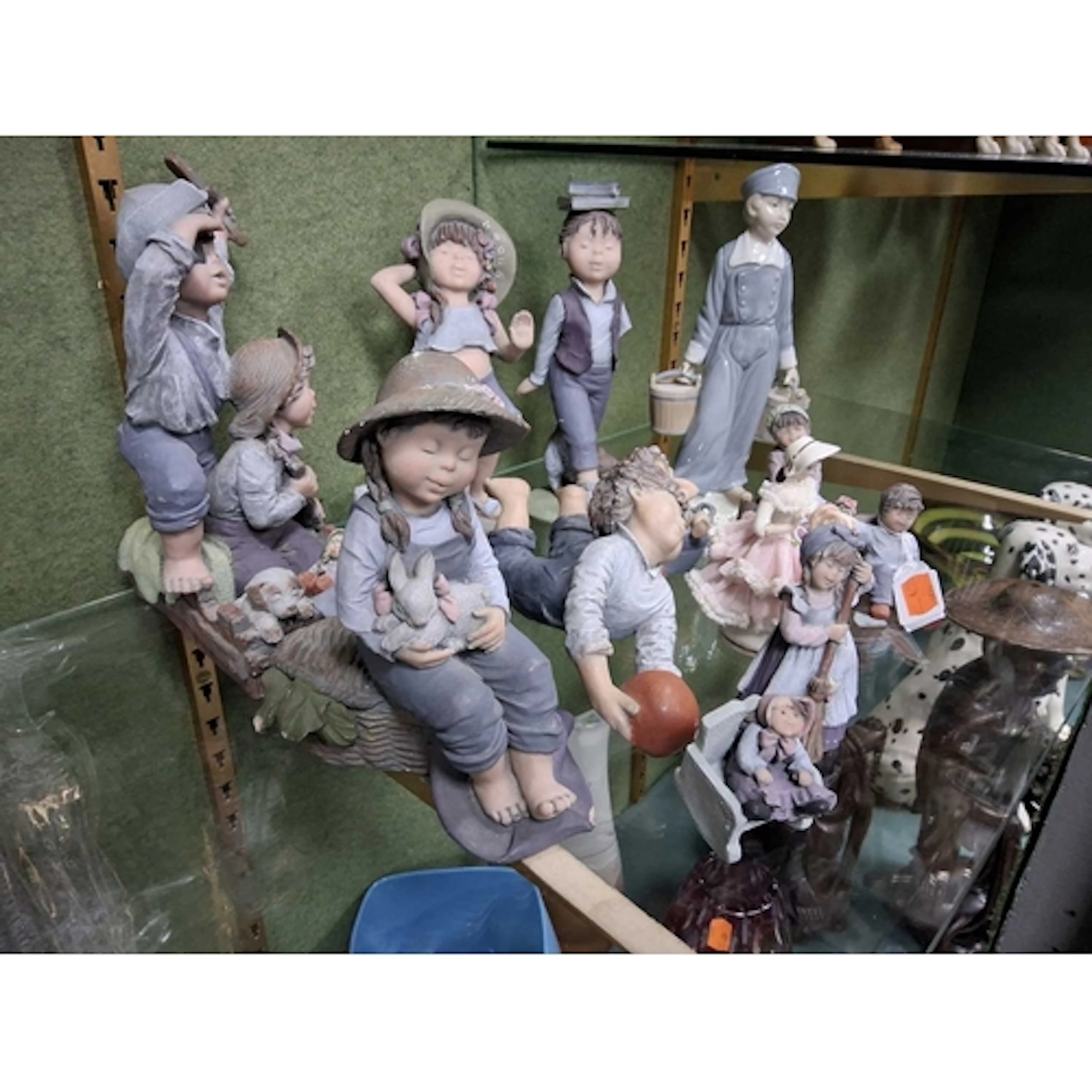 A GROUP OF SPANISH CERAMIC FIGURINES FROM ELISA & LLADRO...