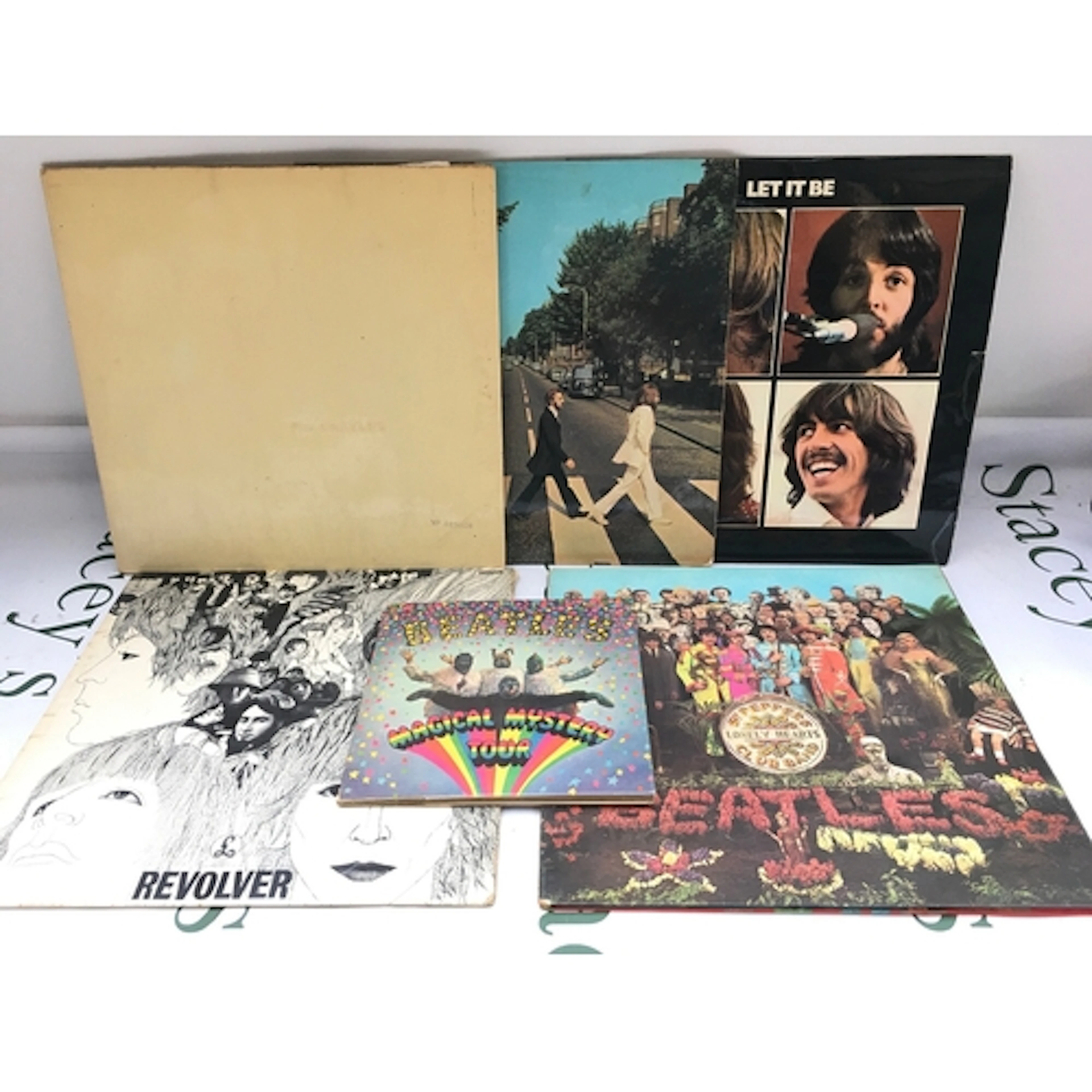 Five early UK pressings of Beatles LPs comprising a numbered...