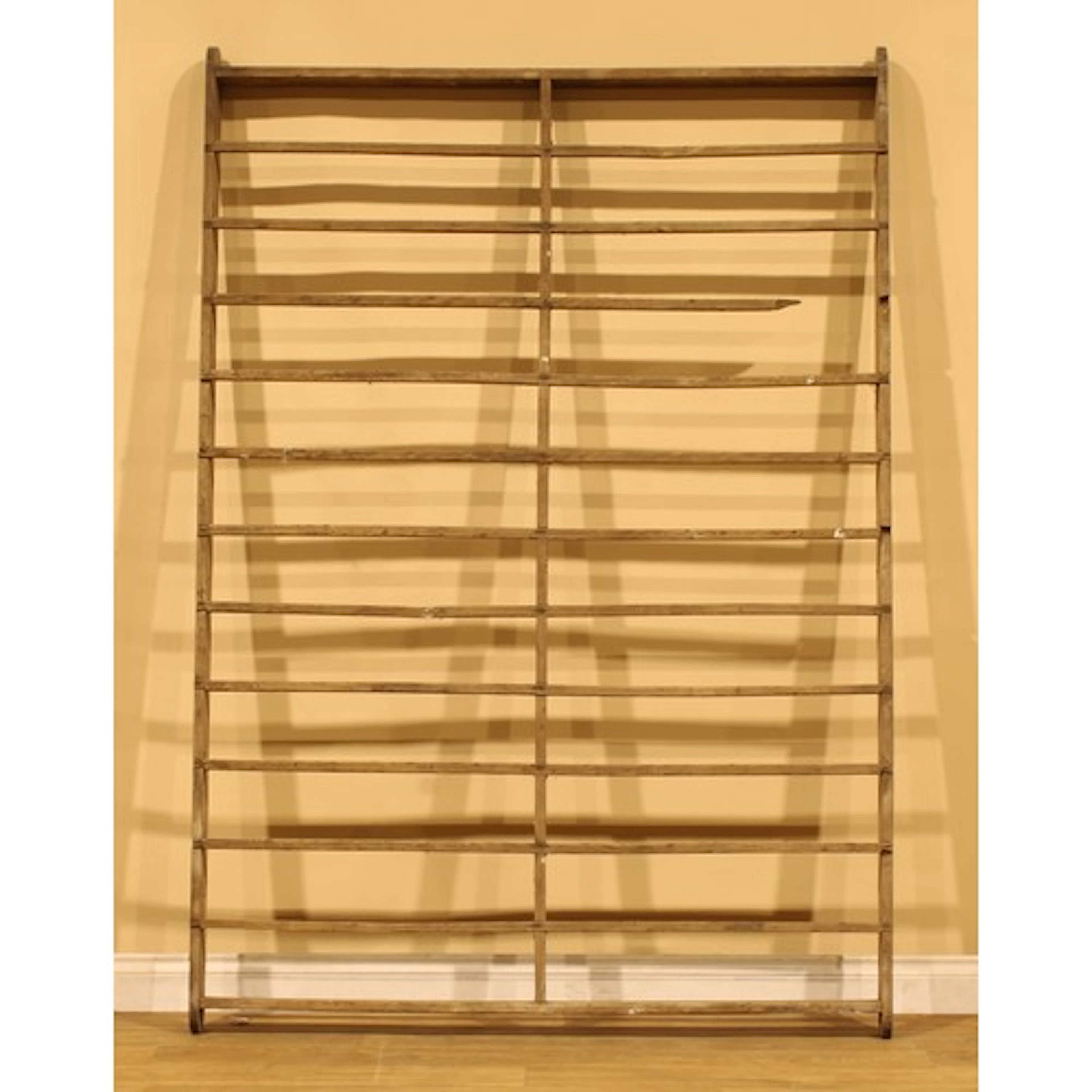 A 19th century oak ceiling hanging bacon rack, eleven slats,...