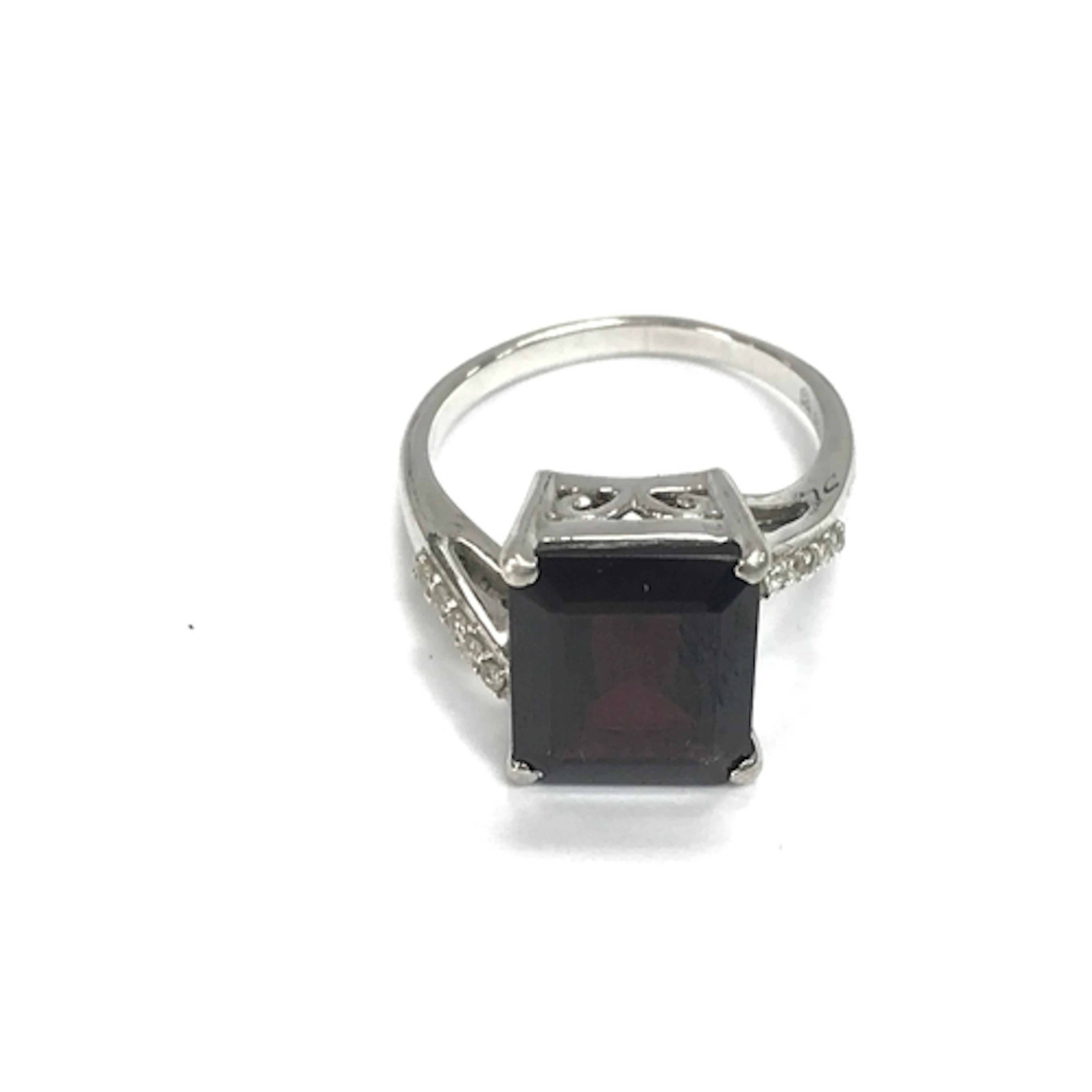 A silver Garnet and white zircon ring. Size N