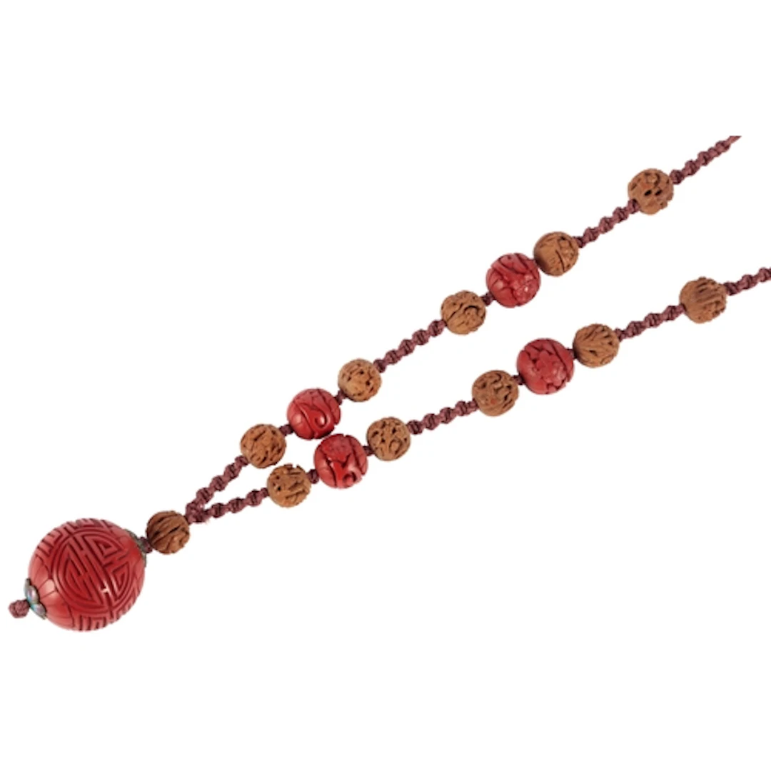 A Chinese cinnabar lacquer bead and cherry stone necklace, f...