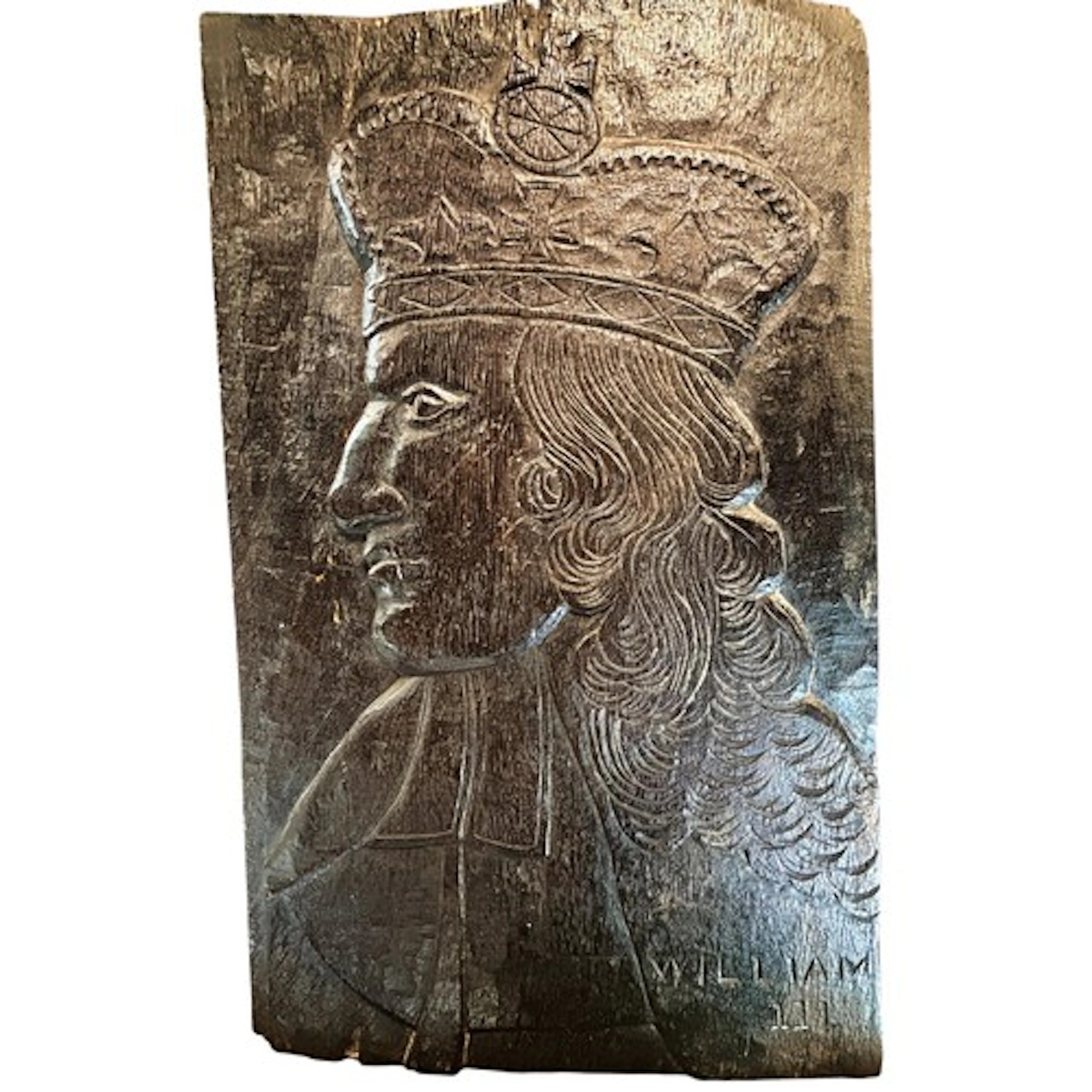 A 17th century or later carved oak profile portrait panel de...