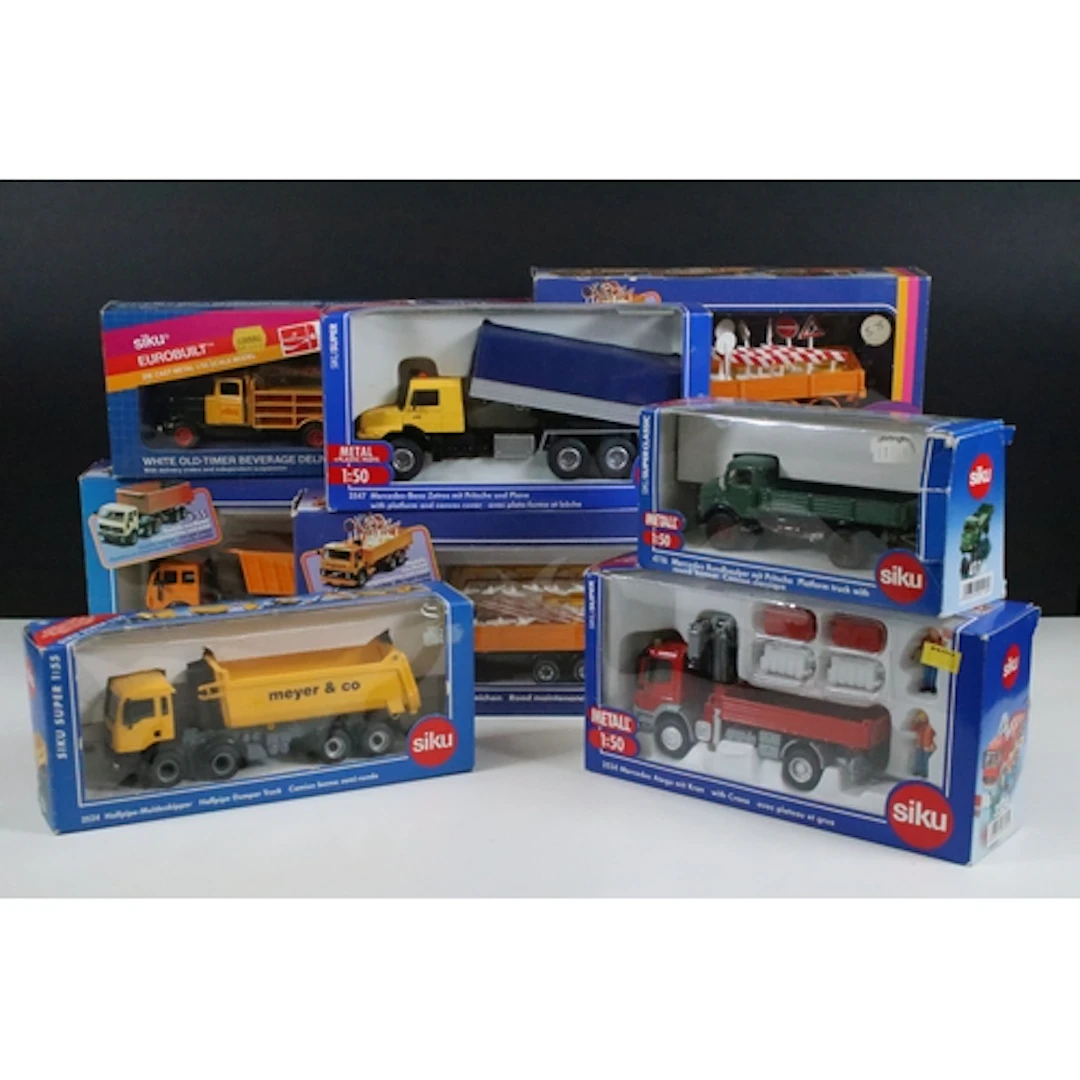 Nine boxed Siku commercial related diecast models to include...