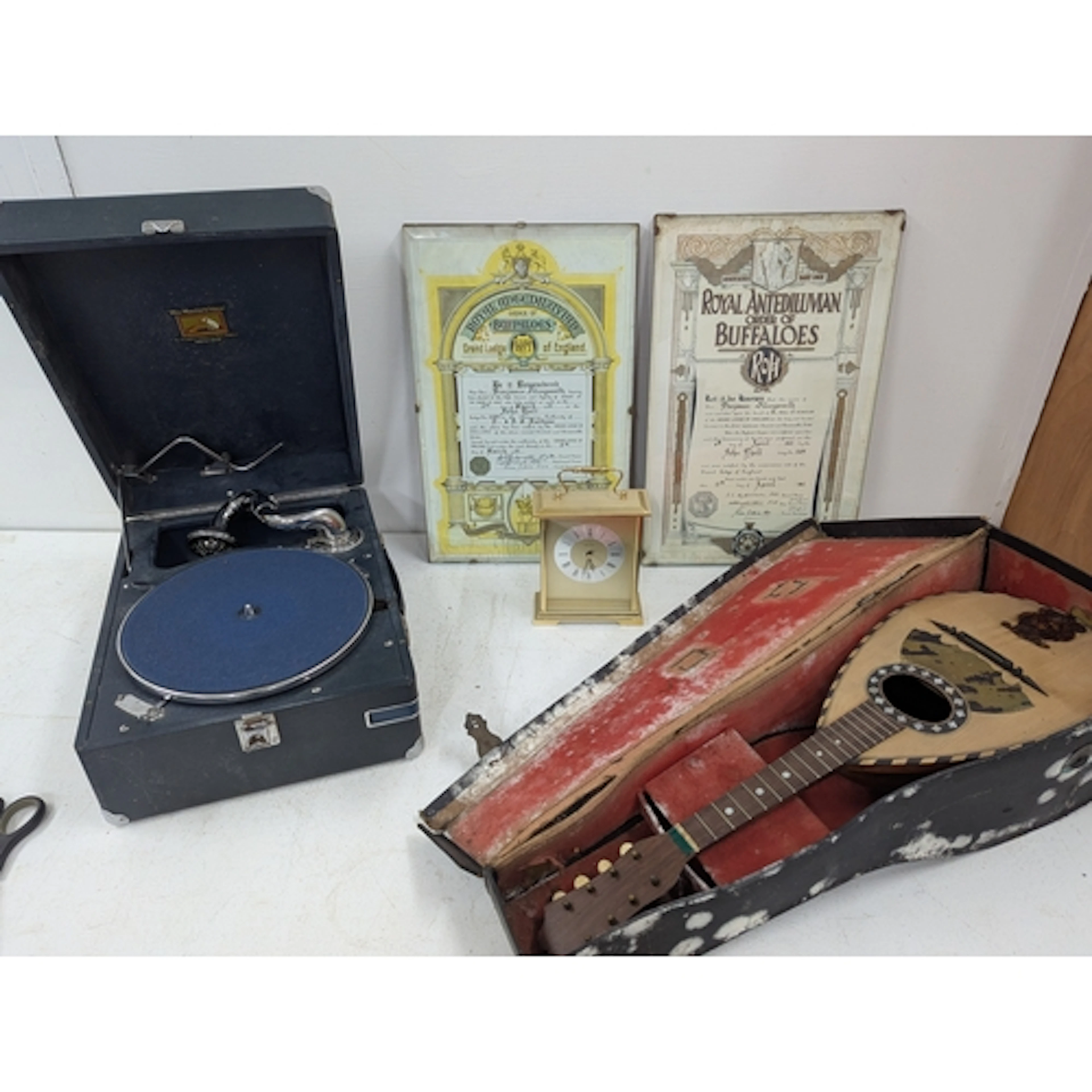 A mixed lot to include a record player, a mandolin, a carria...