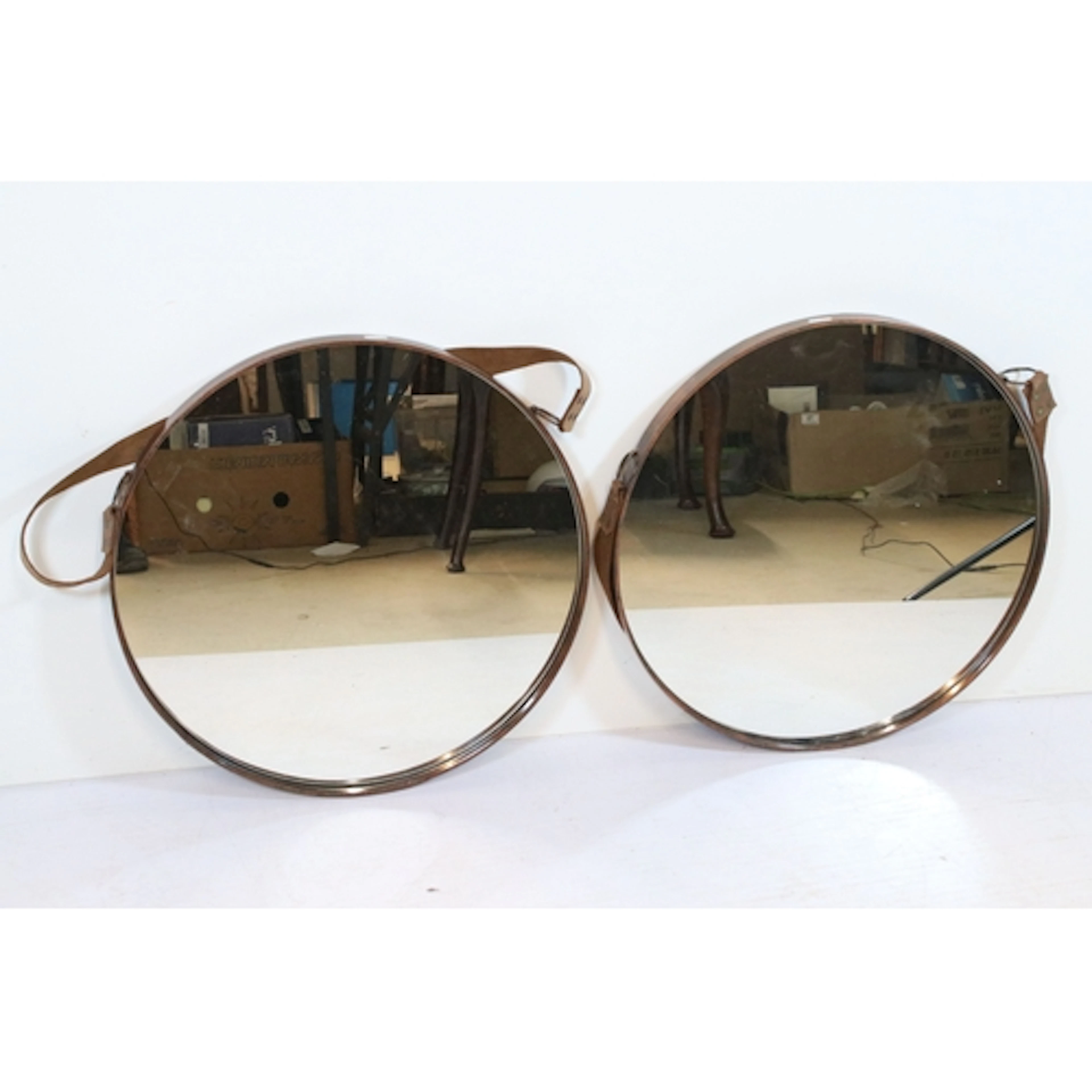 Pair round copper effect wall mirrors with leather hanging s...