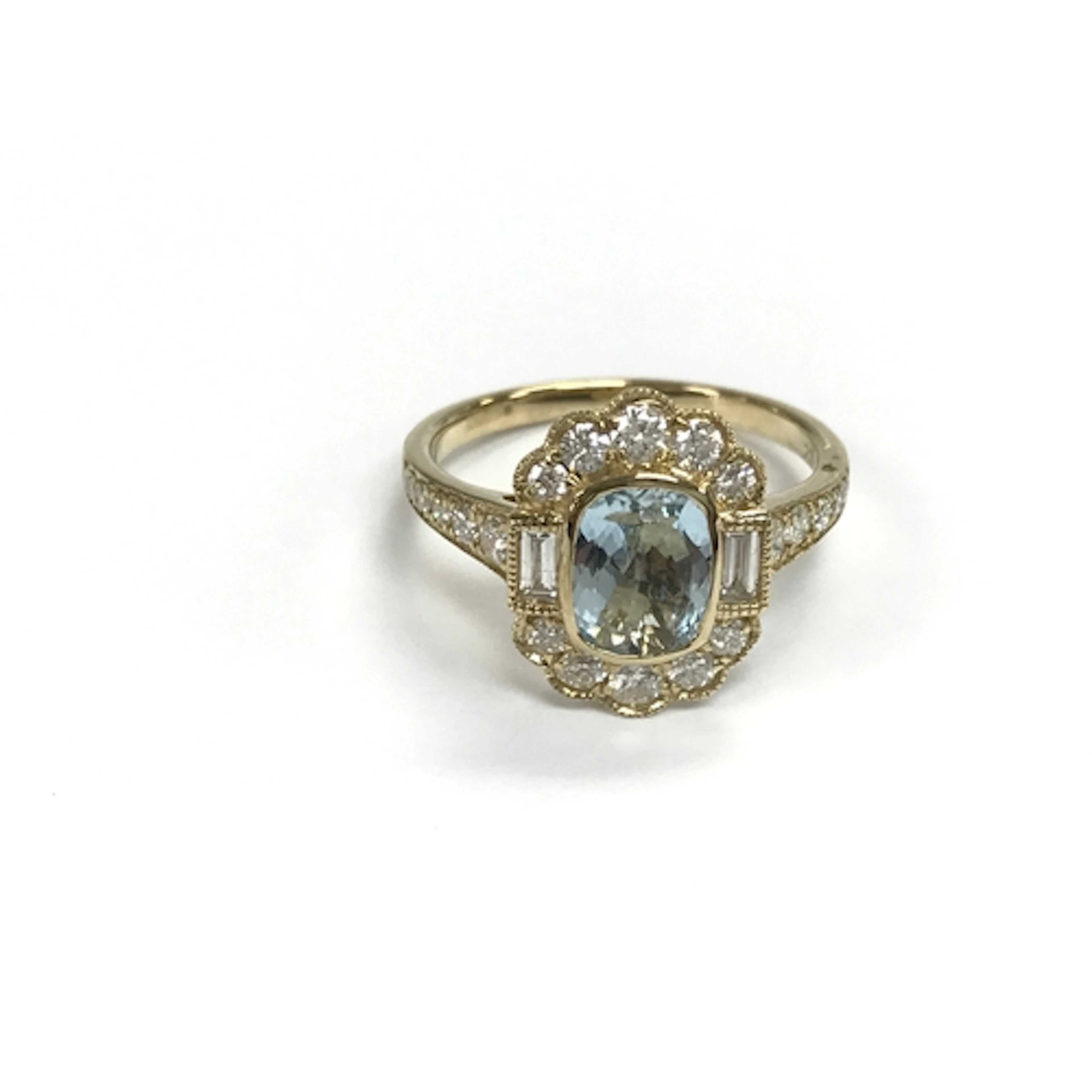 A 9ct gold dress ring set with aquamarine surrounded by diam...