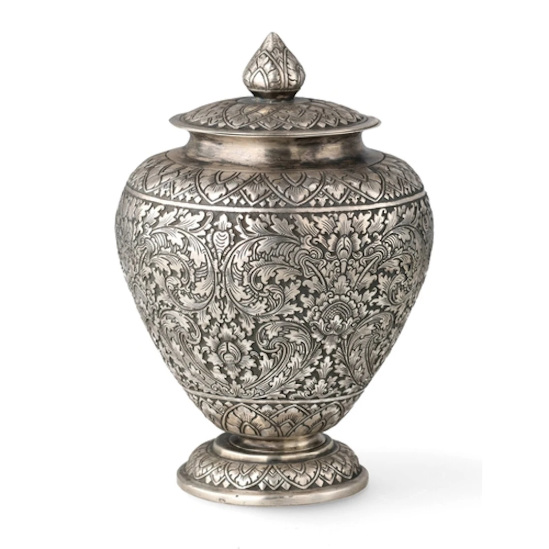 AN ENGRAVED AND CHASED CAMBODIAN SILVER VASE AND LID, CIRCA ...
