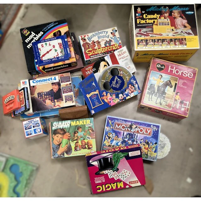 A large selection of vintage games, inc. Disney edition Mono...