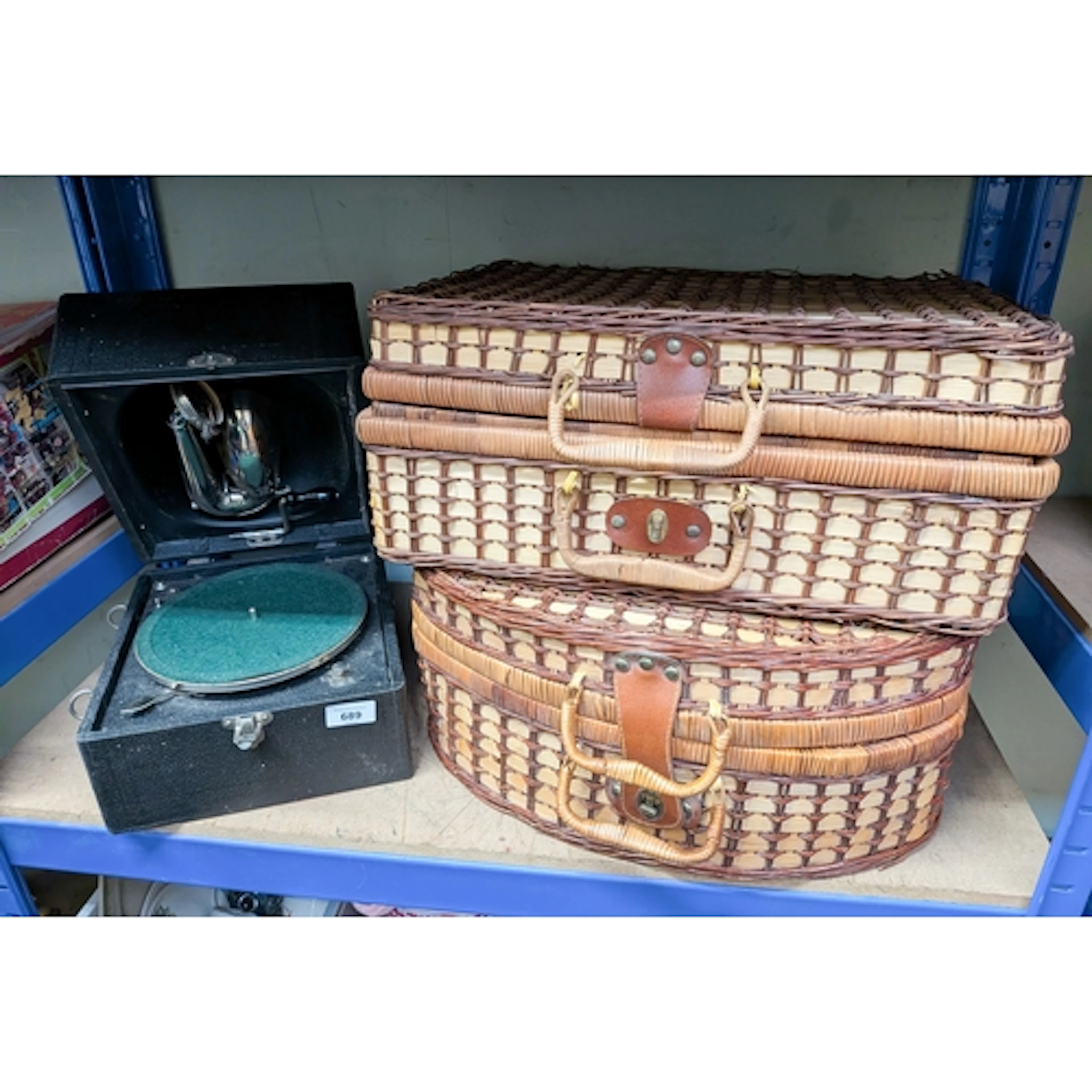Two picnic wicker baskets and a vintage portable gramophone