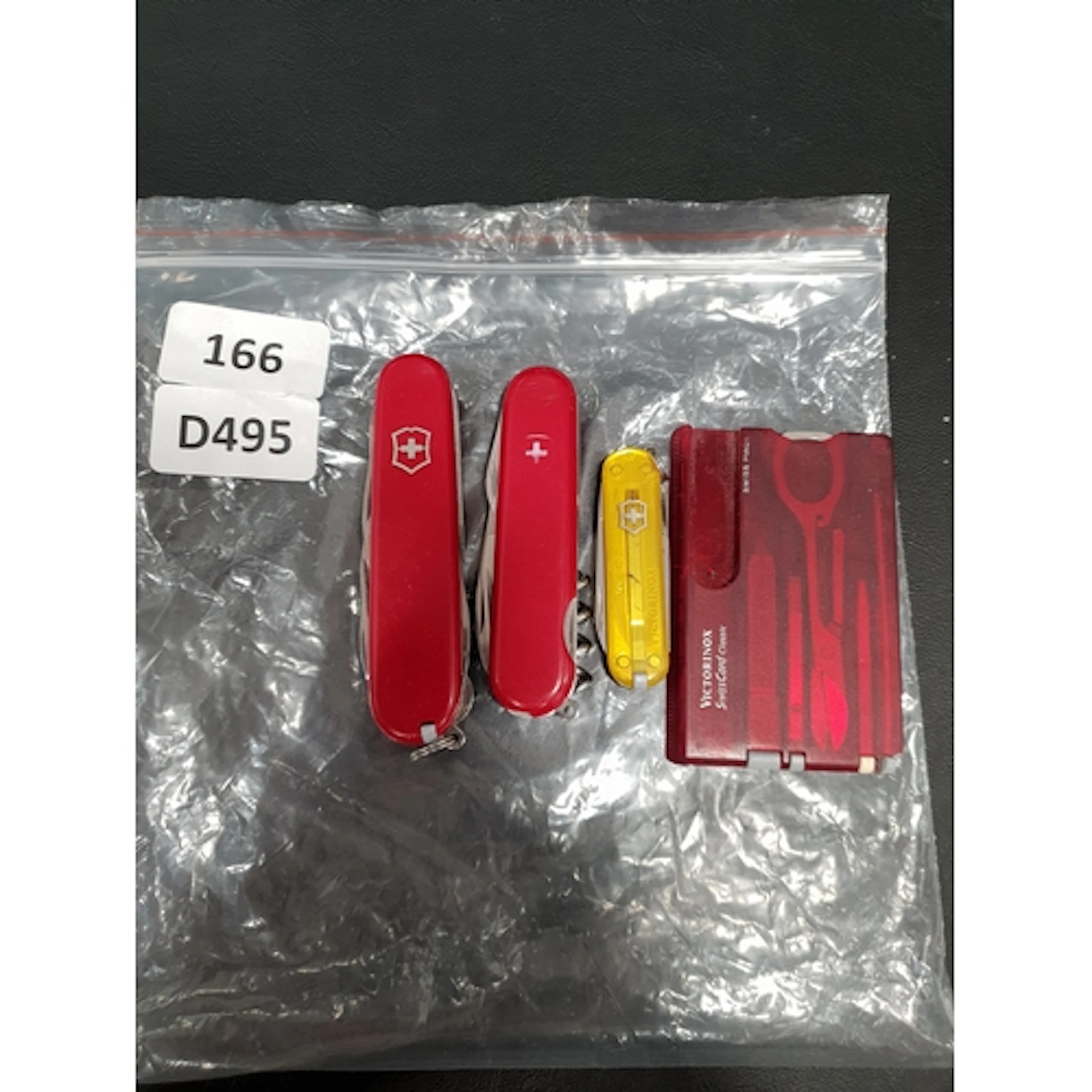 SELECTION OF THREE VICTORINOX SWISS ARMY KNIVES comprising o...