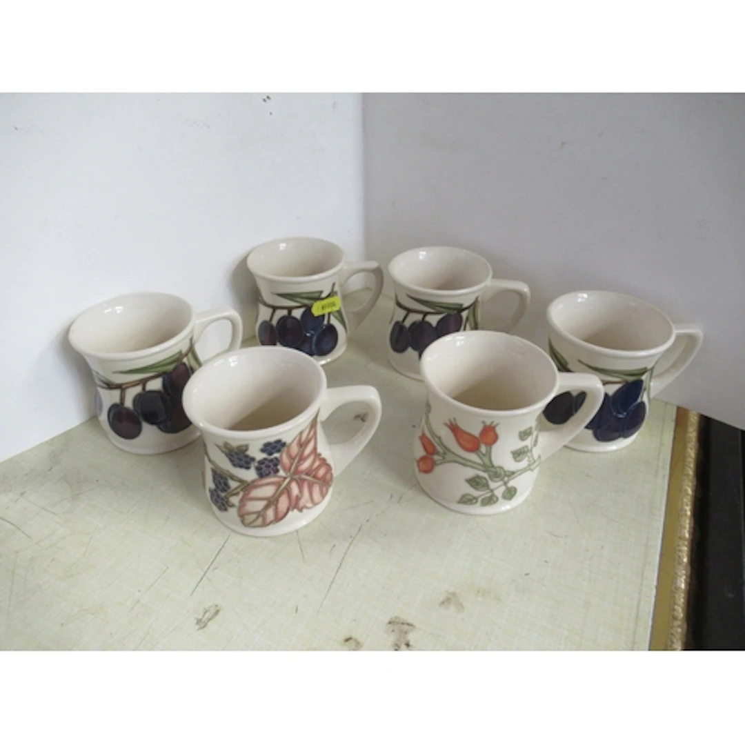 Six Moorcroft pottery mugs