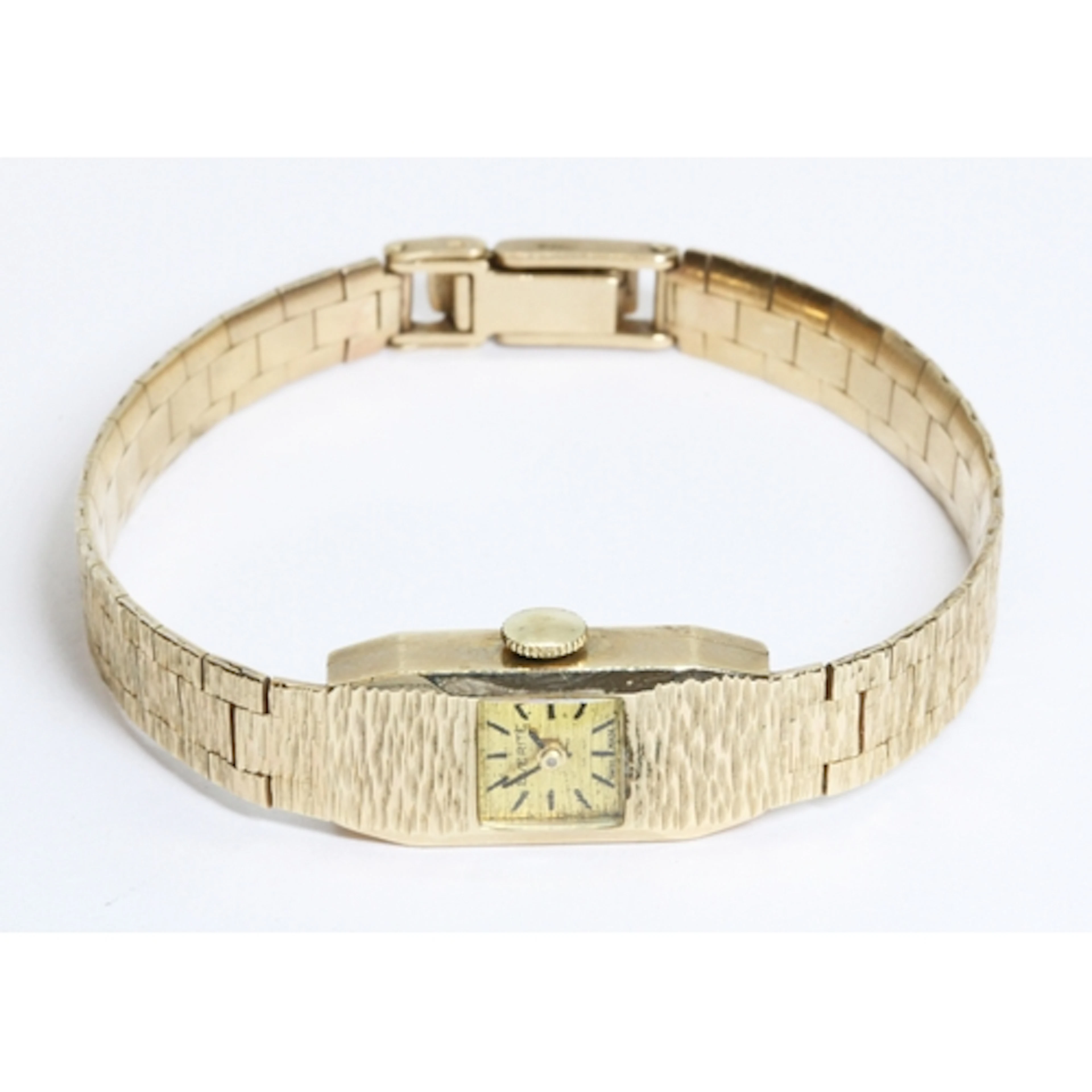 A ladies Everite 9ct gold wristwatch with integrated texture...