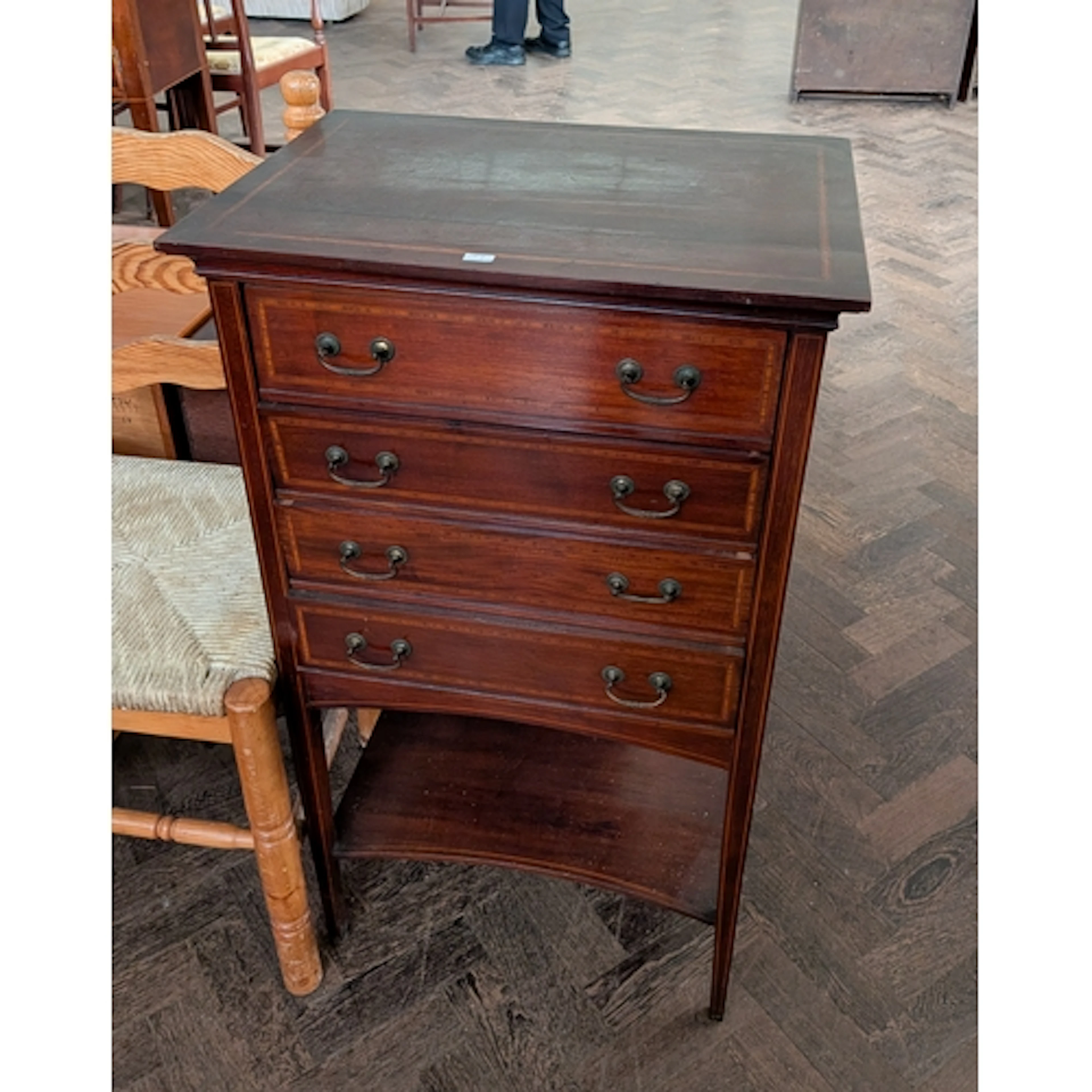 An Edwardian inlaid mahogany music cabinet fitted four drawe...