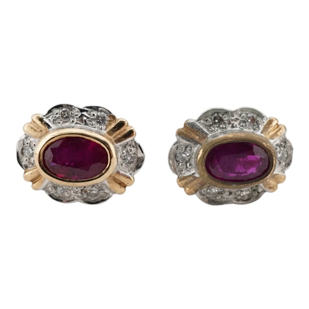 A pair of ruby and diamond stud earrings, collet-set with ov...