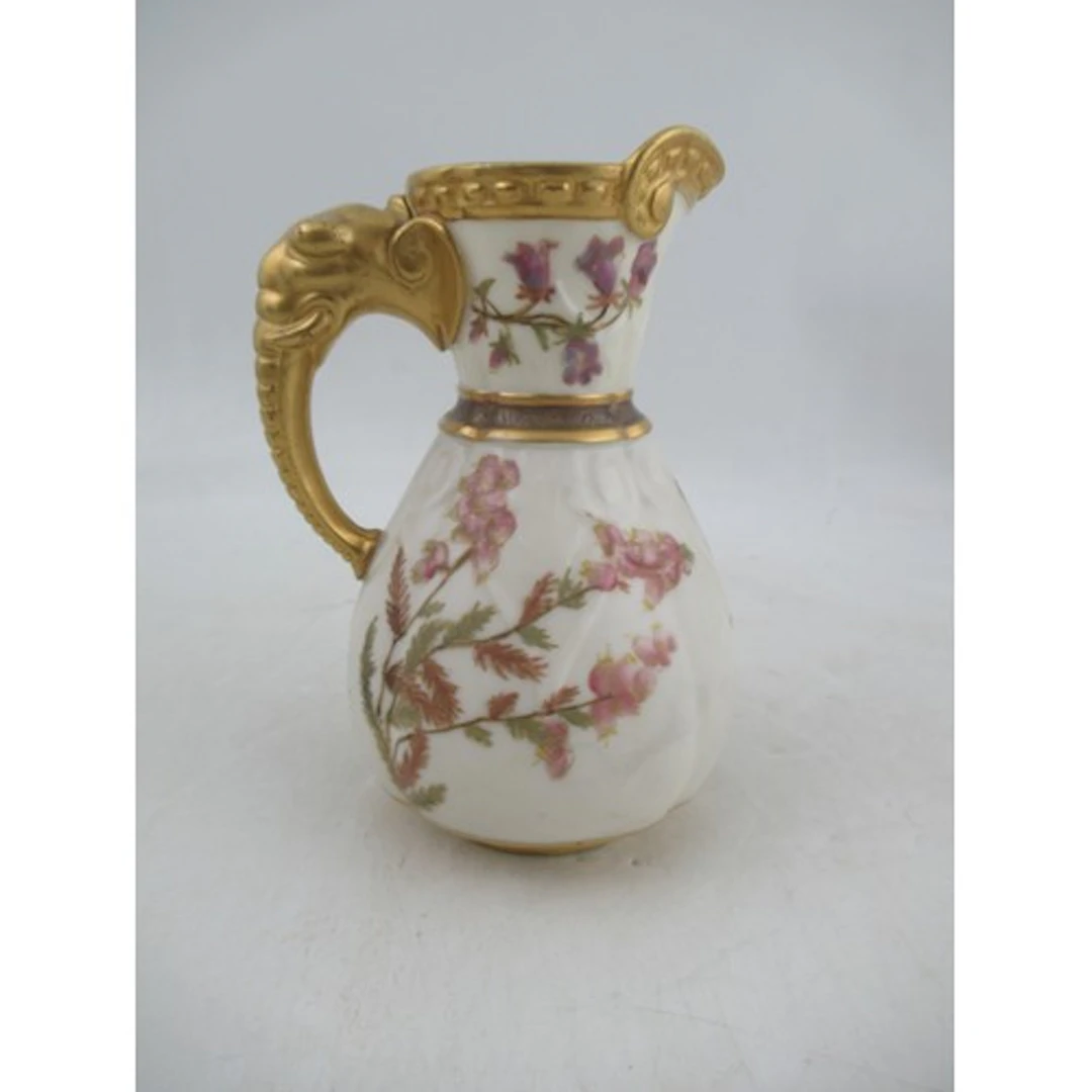 A Royal Worcester gilded ivory jug, decorated with shot silk...
