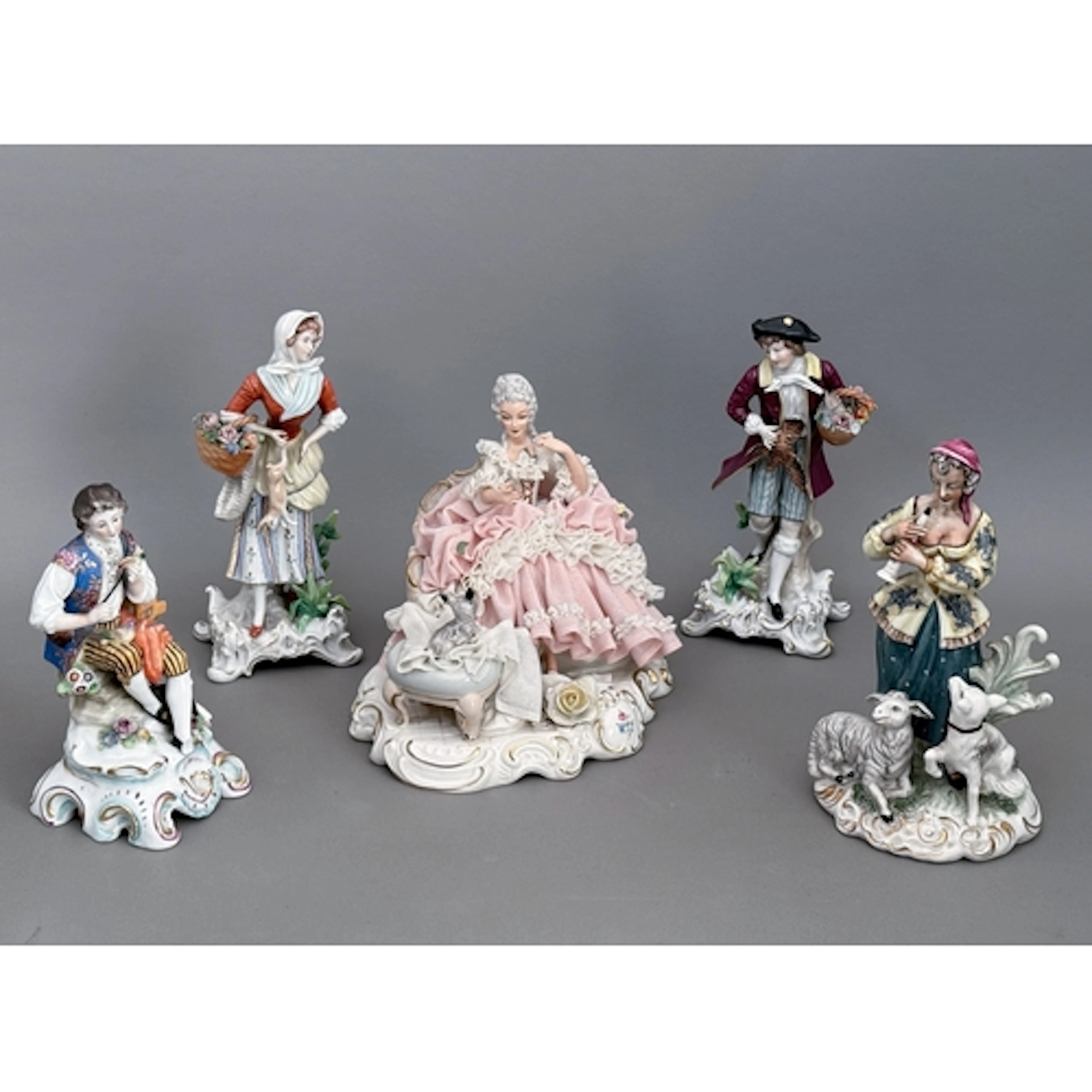 A group of continental decorative porcelain figurines - to i...