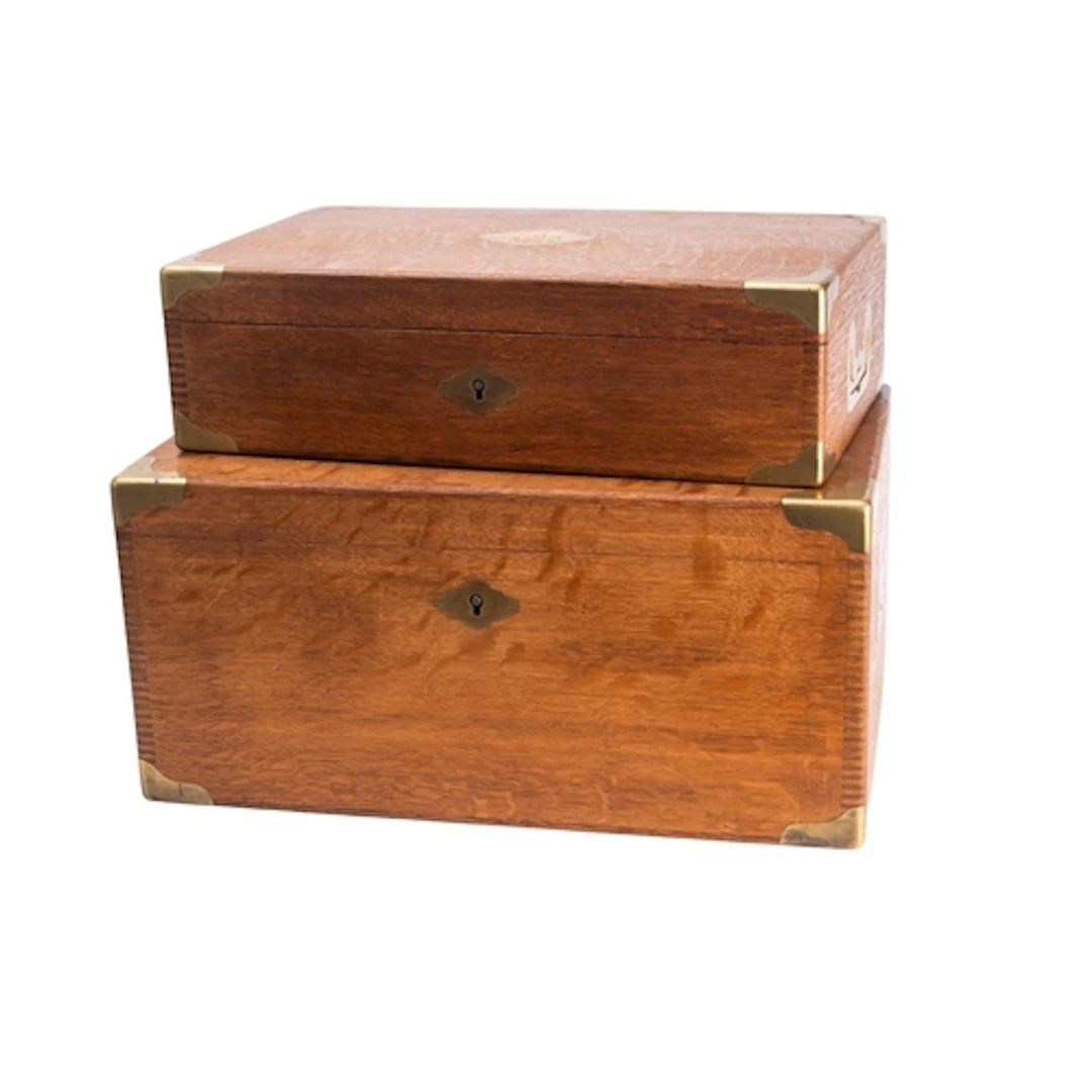 Two similar Napoleon III oak and brass bound strong boxes, b...
