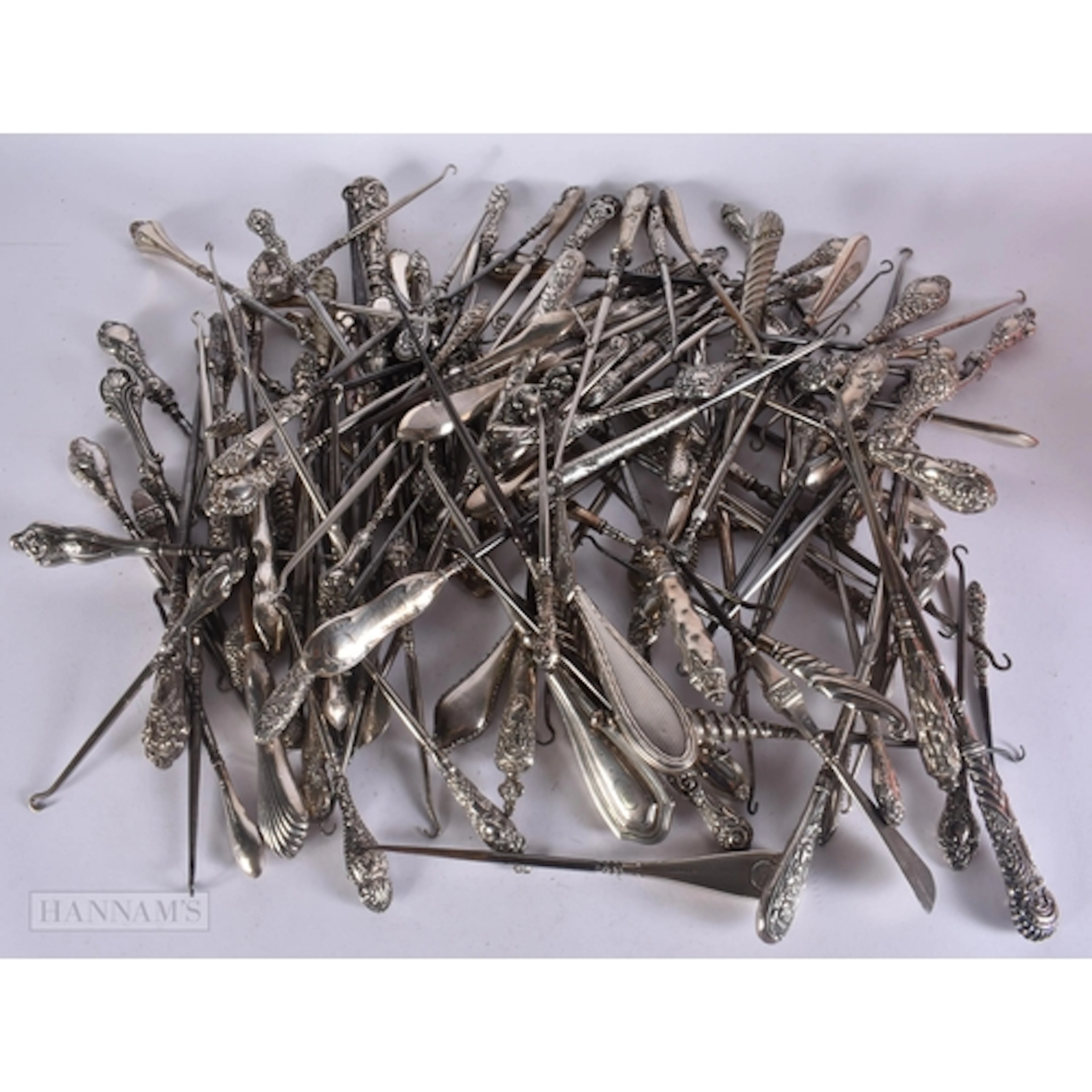 A MASSIVE COLLECTION OF ANTIQUE SILVER HANDLED BUTTON HOOKS ...