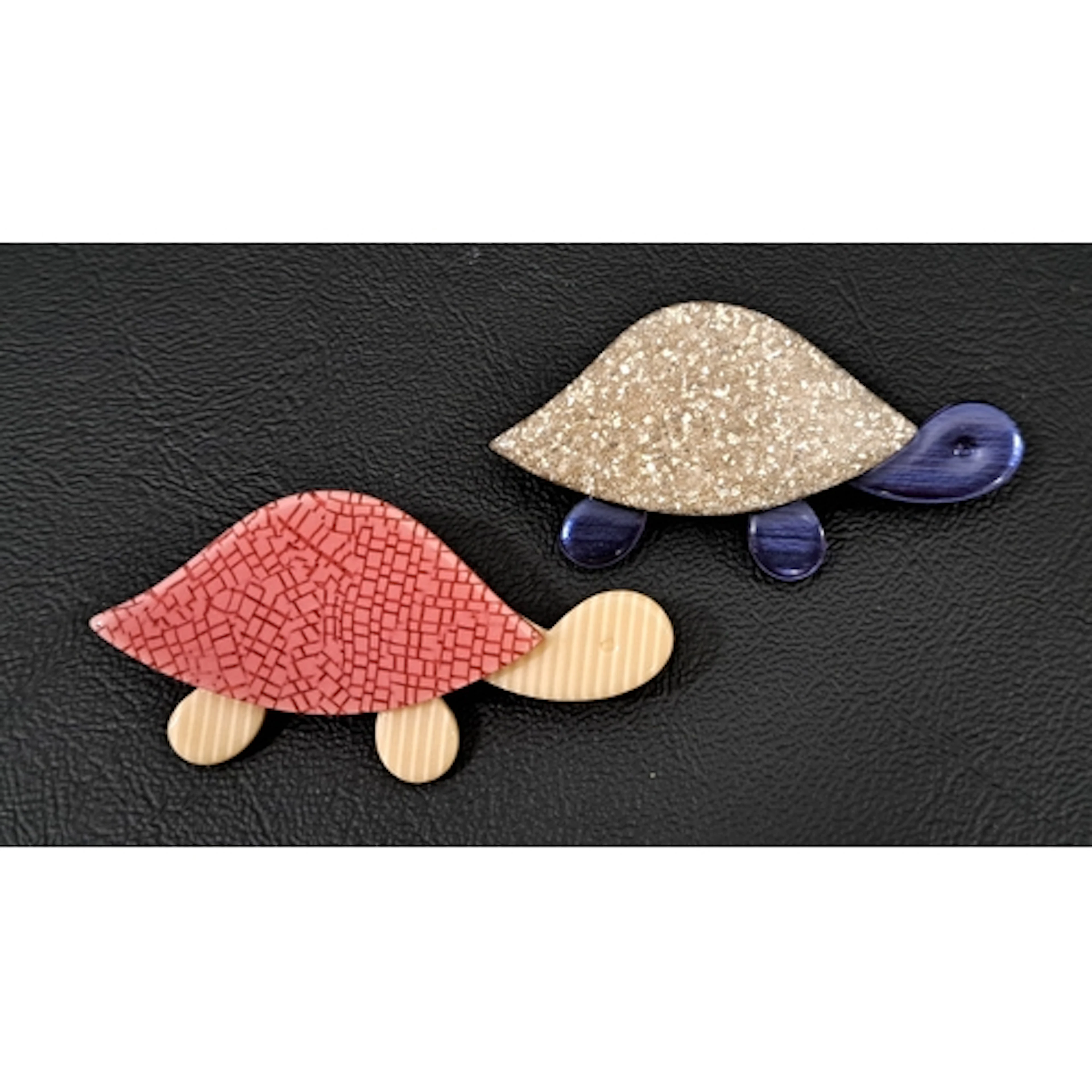TWO LEA STEIN TORTOISE BROOCHES one with silver glitter shel...