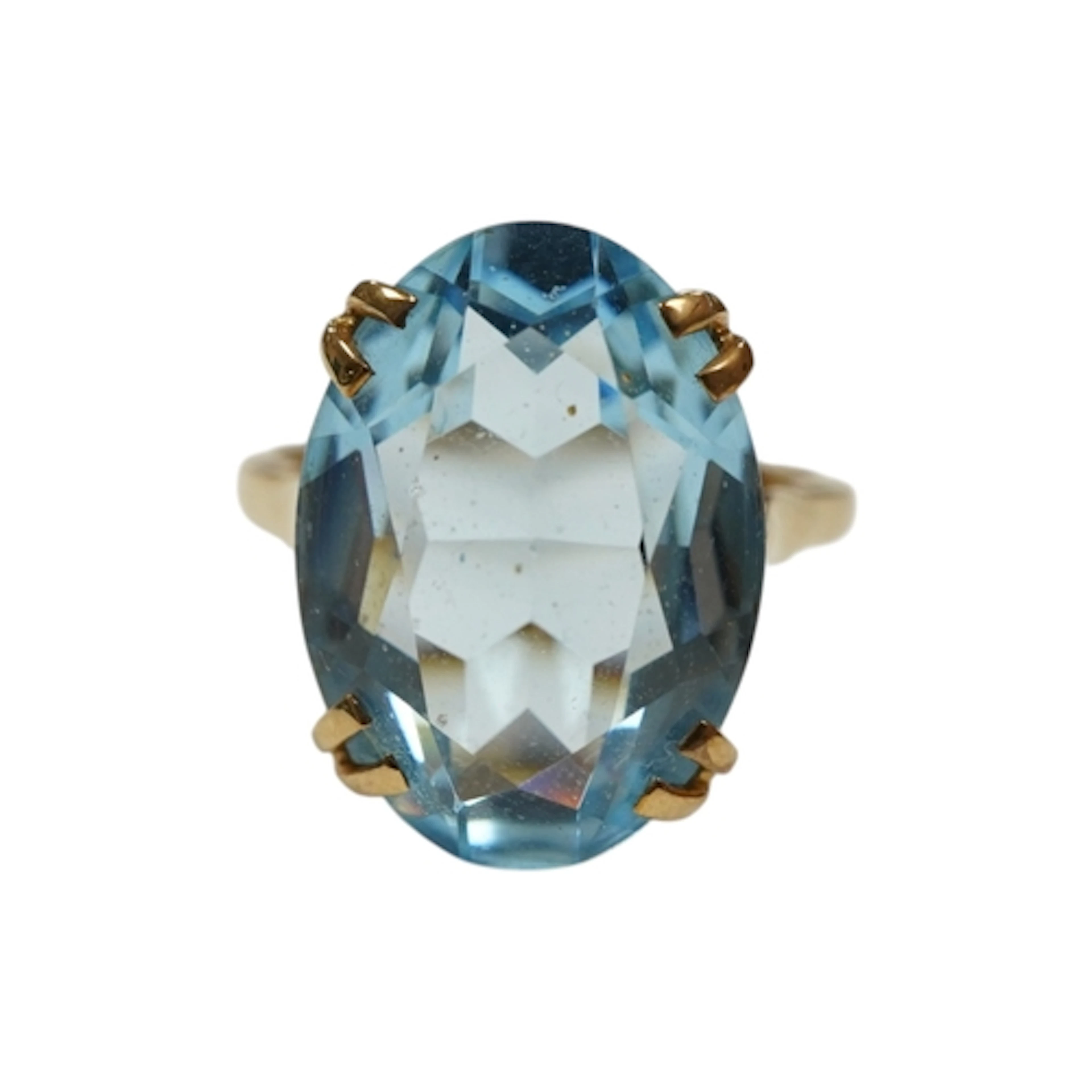 A 9ct gold and synthetic oval cut blue spinel ring, size R, ...