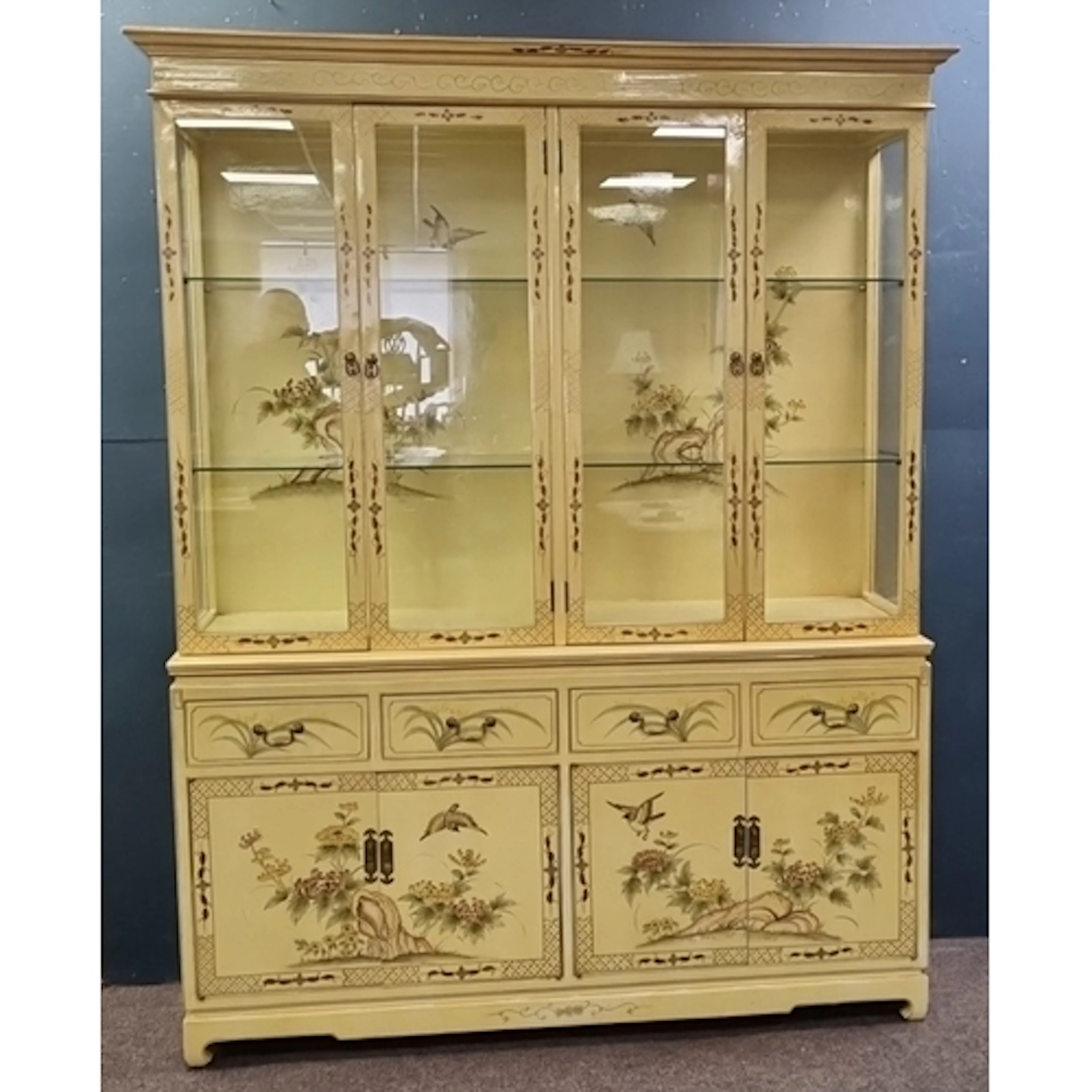 Cream Chinoiserie-style display cabinet with glazed upper se...