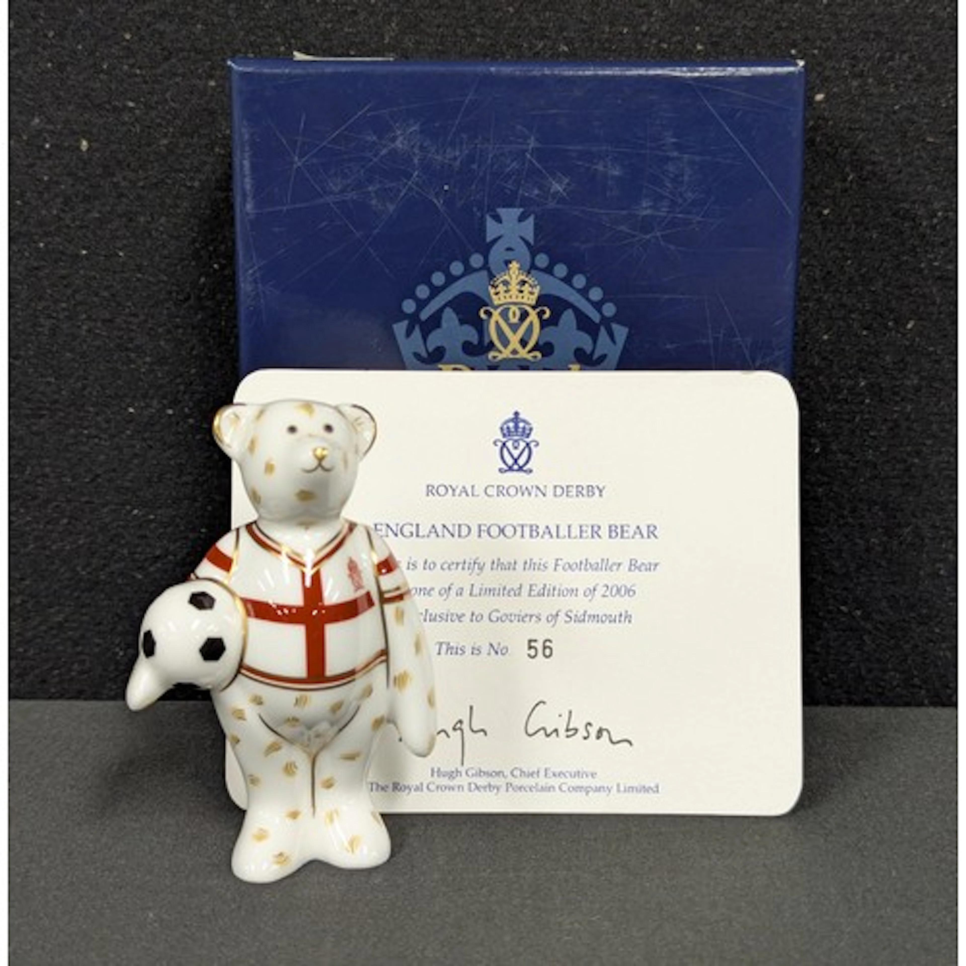 A Royal Crown Derby miniature bear model, England Footballer...