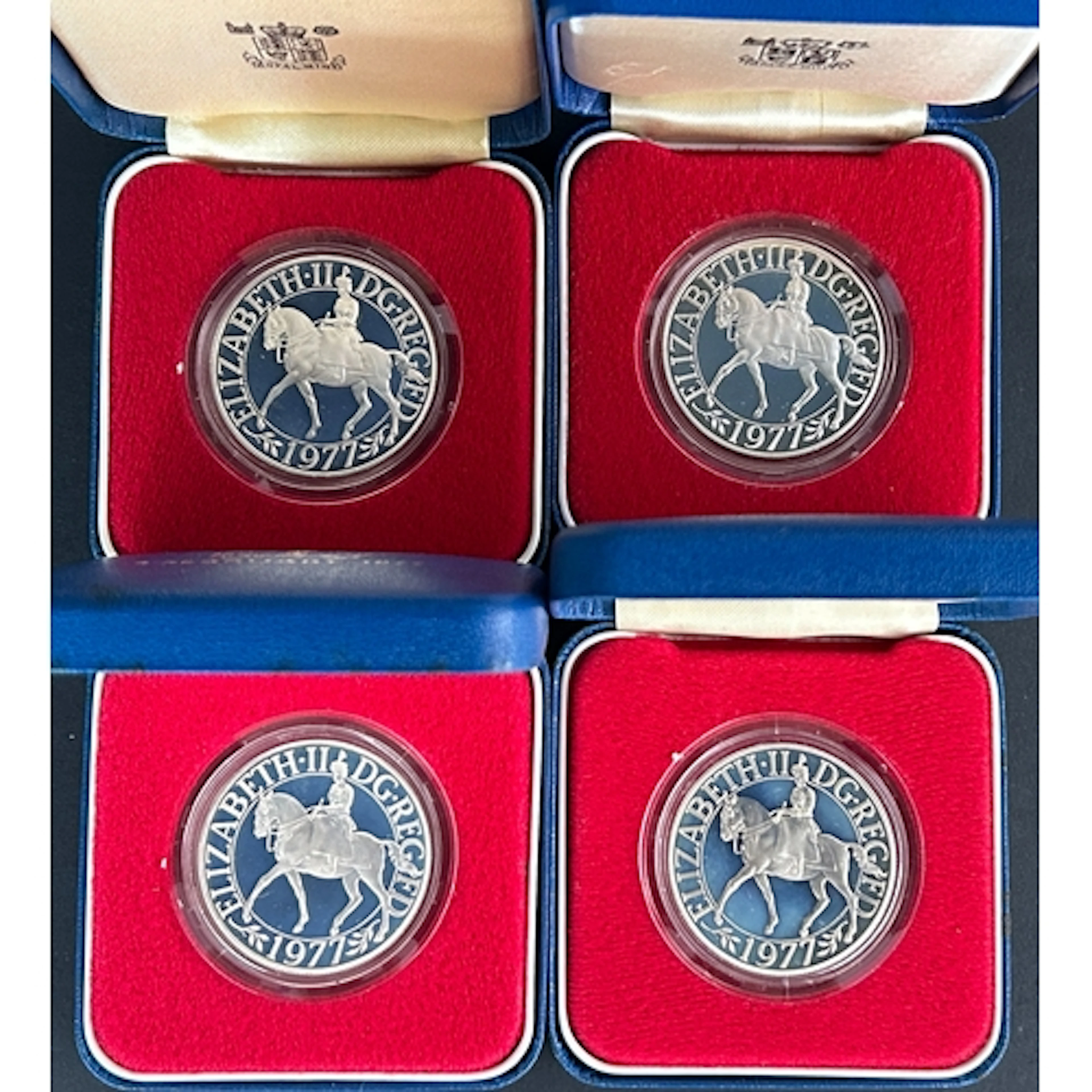 A group of four British 1977 silver proof crowns commemorati...