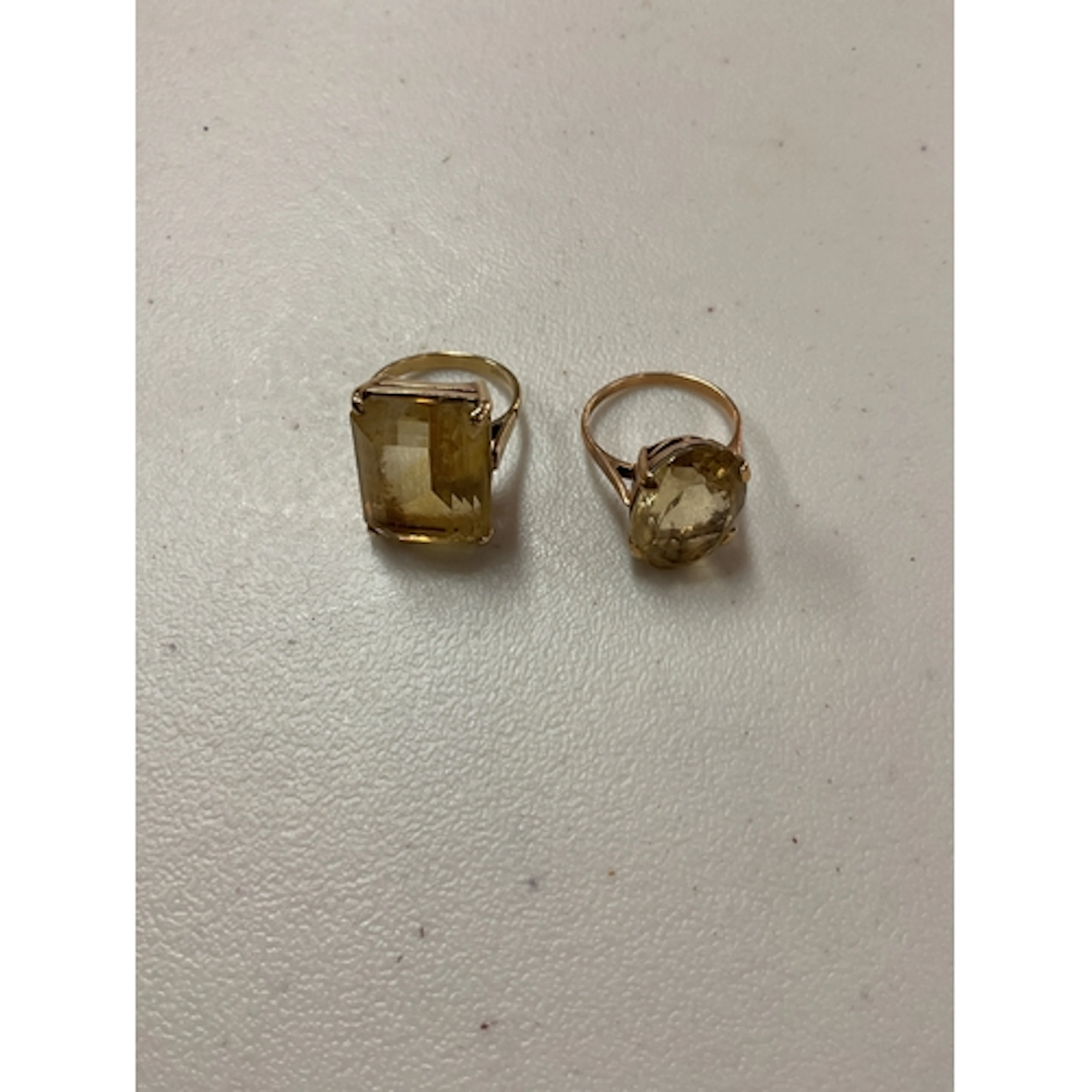 Two large 9ct stone set rings, oval and emerald cut examples...
